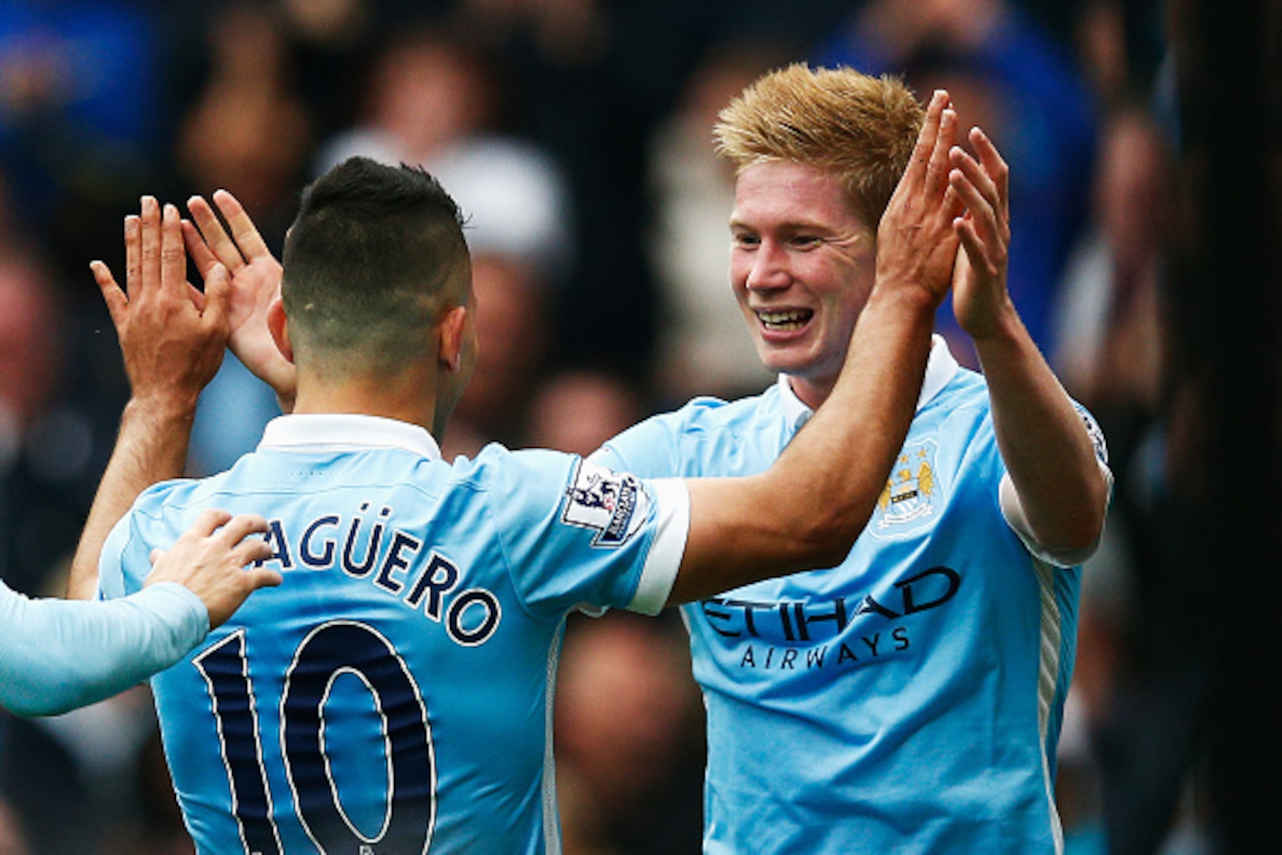MANCHESTER, ENGLAND - OCTOBER 03:  Sergio Aguero (L) of Manchester City celebrates scoring his fourth and team's fifth goal with Kevin de Bruyne (R) during the Barclays Premier League match between Manchester City and Newcastle United at Etihad Stadium on