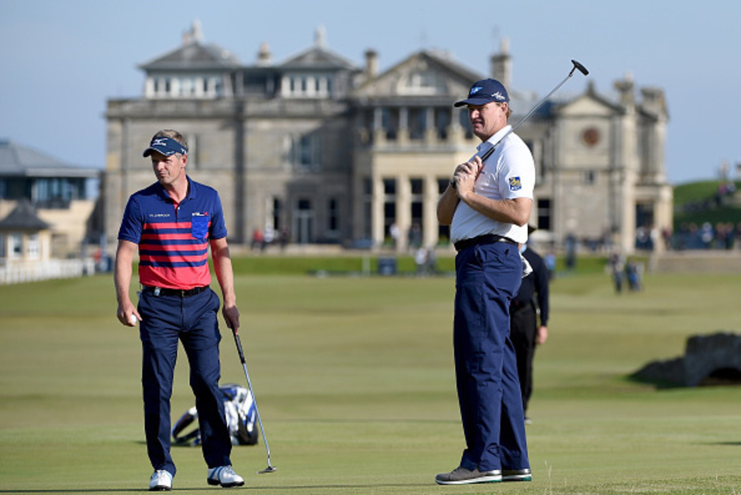 ST ANDREWS, SCOTLAND - OCTOBER 03:  Ernie Els of South Africa reacts after putting in the 17th green watched by Luke Donald during the third round of the 2015 Alfred Dunhill Links Championship at The Old Course on October 3, 2015 in St Andrews, Scotland. 