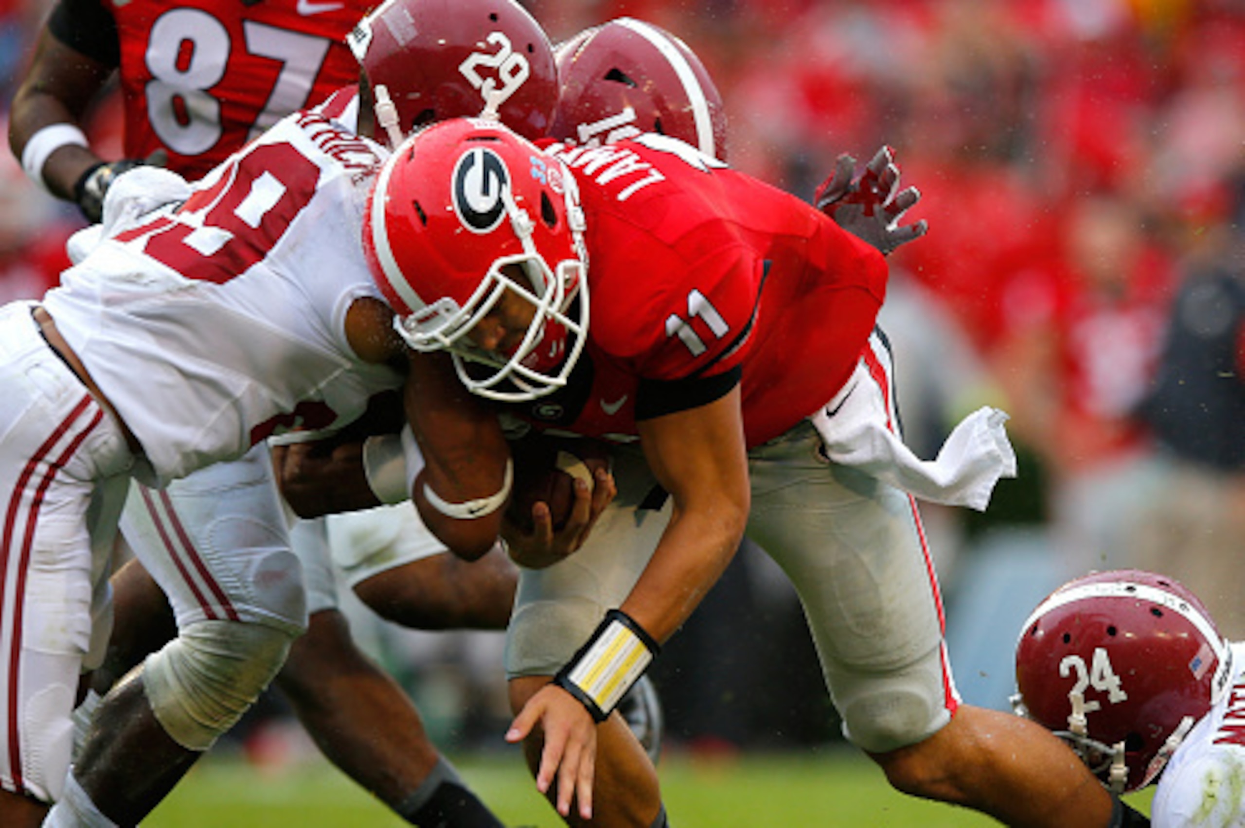 ATHENS, GA - OCTOBER 03:  Greyson Lambert #11 of the Georgia Bulldogs is tackled by Minkah Fitzpatrick #29, Reggie Ragland #19 and Geno Matias-Smith #24 of the Alabama Crimson Tide at Sanford Stadium on October 3, 2015 in Athens, Georgia.  (Photo by Kevin