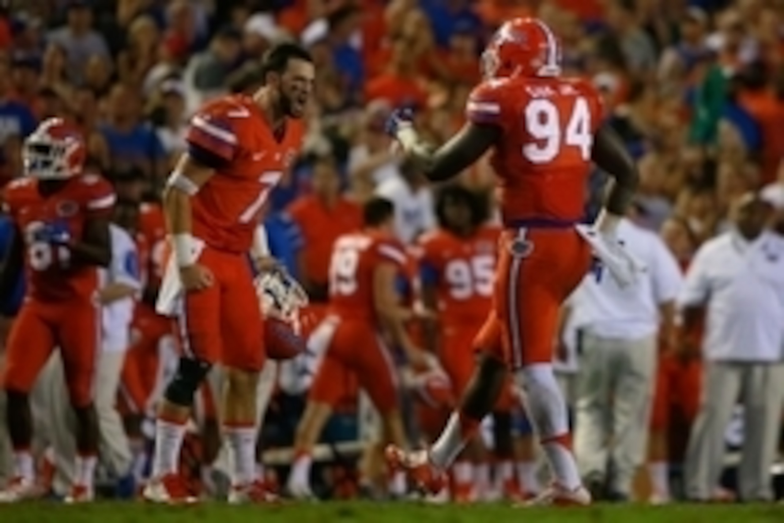 Sep 12, 2015; Gainesville, FL, USA; Florida Gators quarterback Will Grier (7) congratulates Florida Gators defensive lineman Bryan Cox (94) during the second quarter at Ben Hill Griffin Stadium  . Mandatory Credit: Kim Klement-USA TODAY Sports
