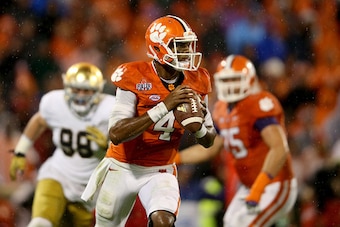 CLEMSON, SC - OCTOBER 03:  Deshaun Watson #4 of the Clemson Tigers runs with the ball against the Notre Dame Fighting Irish during their game at Clemson Memorial Stadium on October 3, 2015 in Clemson, South Carolina.  (Photo by Streeter Lecka/Getty Images