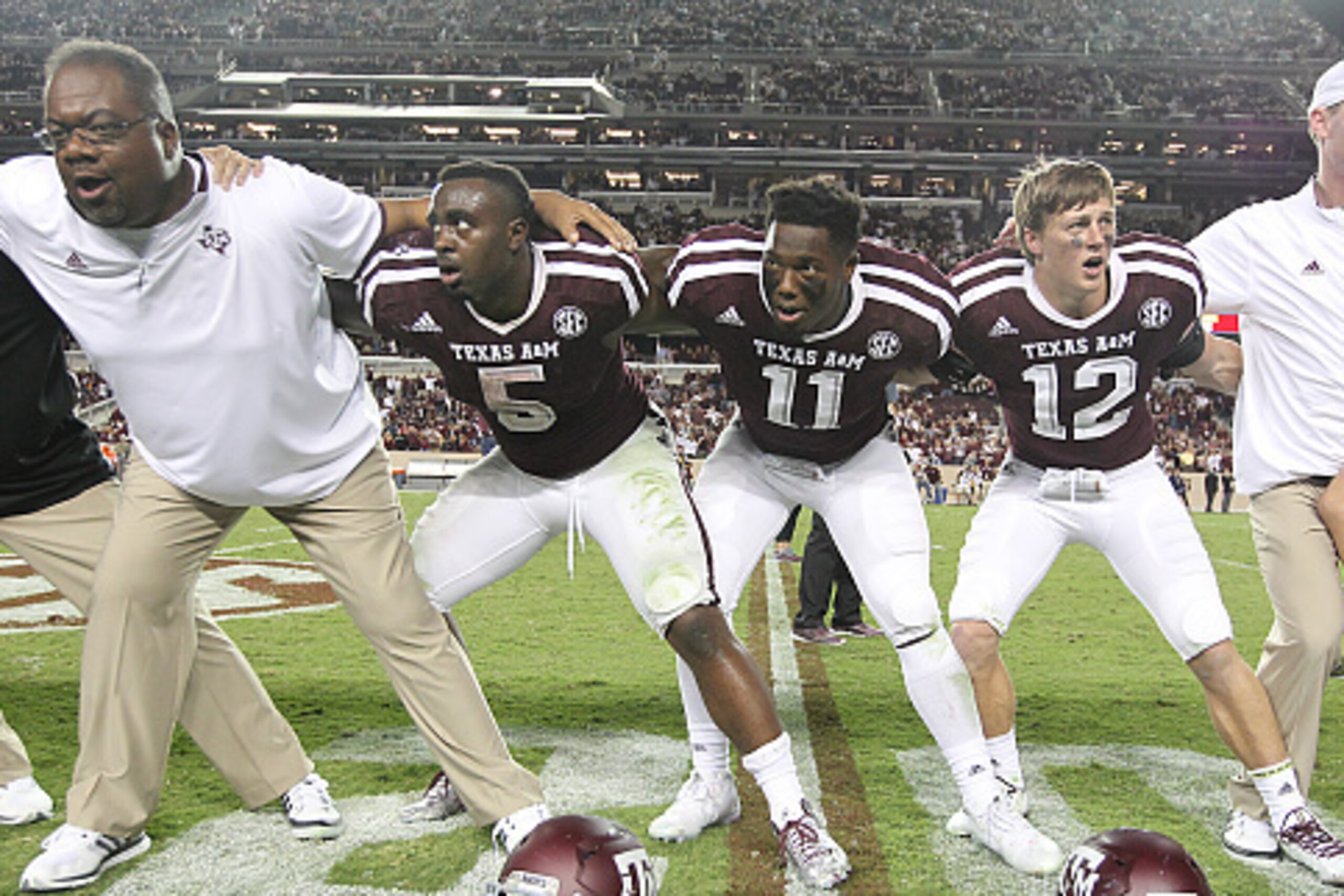 COLLEGE STATION, TX - OCTOBER 03: Tra Carson #5  , Josh Reynolds #11 and Sam Moeller #12 of the Texas A&M Aggies celebrate the win over the Mississippi State Bulldogs in the fourth quarter on October 3, 2015 at Kyle Field in College Station, Texas. Aggies