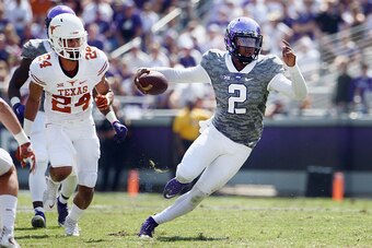 FORT WORTH, TX - OCTOBER 03:  Trevone Boykin #2 of the TCU Horned Frogs carries the ball against John Bonney #24 of the Texas Longhorns in the third quarter at Amon G. Carter Stadium on October 3, 2015 in Fort Worth, Texas.  (Photo by Tom Pennington/Getty