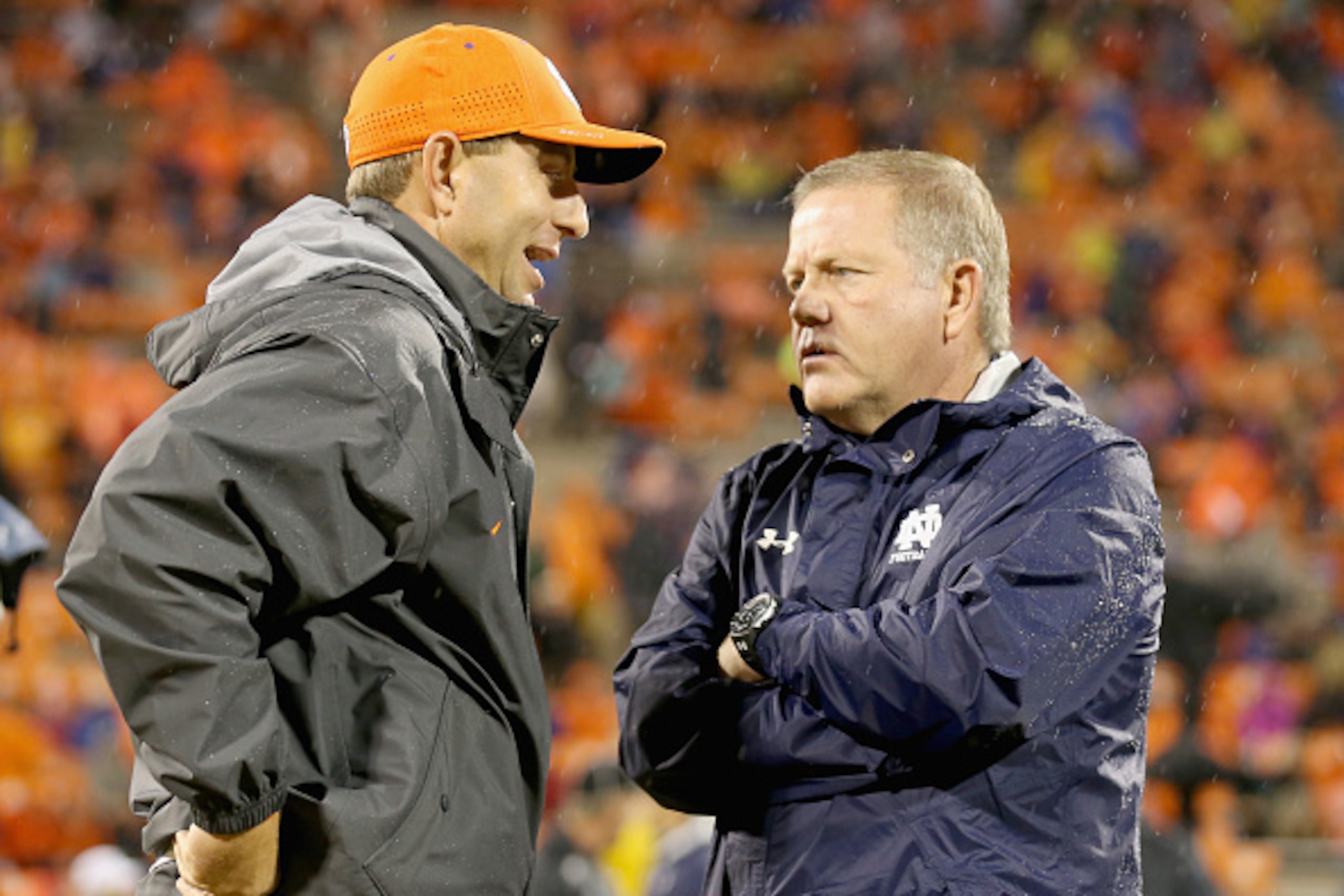 CLEMSON, SC - OCTOBER 03:  (L-R) Head coach Dabo Swinney of the Clemson Tigers talks to head coach Brian Kelly of the Notre Dame Fighting Irish before their game at Clemson Memorial Stadium on October 3, 2015 in Clemson, South Carolina.  (Photo by Streete