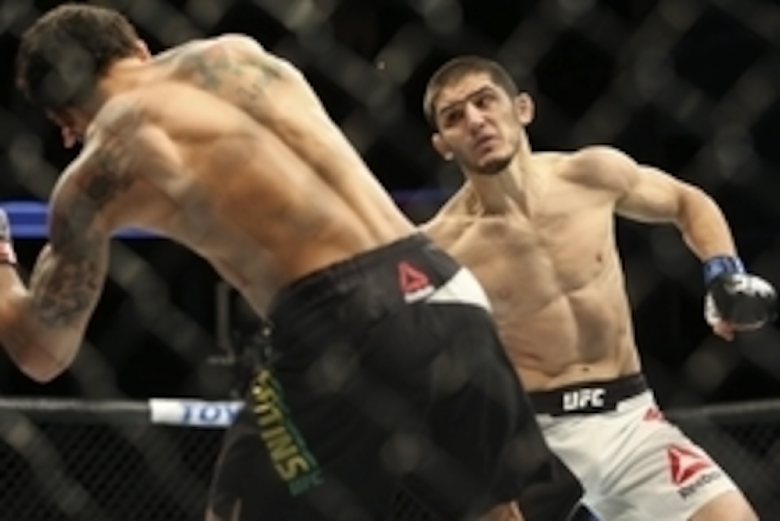 Oct 3, 2015; Houston, TX, USA; Adriano Martins (red gloves) competes against Islam Makhachev (blue gloves) during UFC 192 at Toyota Center. Mandatory Credit: Troy Taormina-USA TODAY Sports