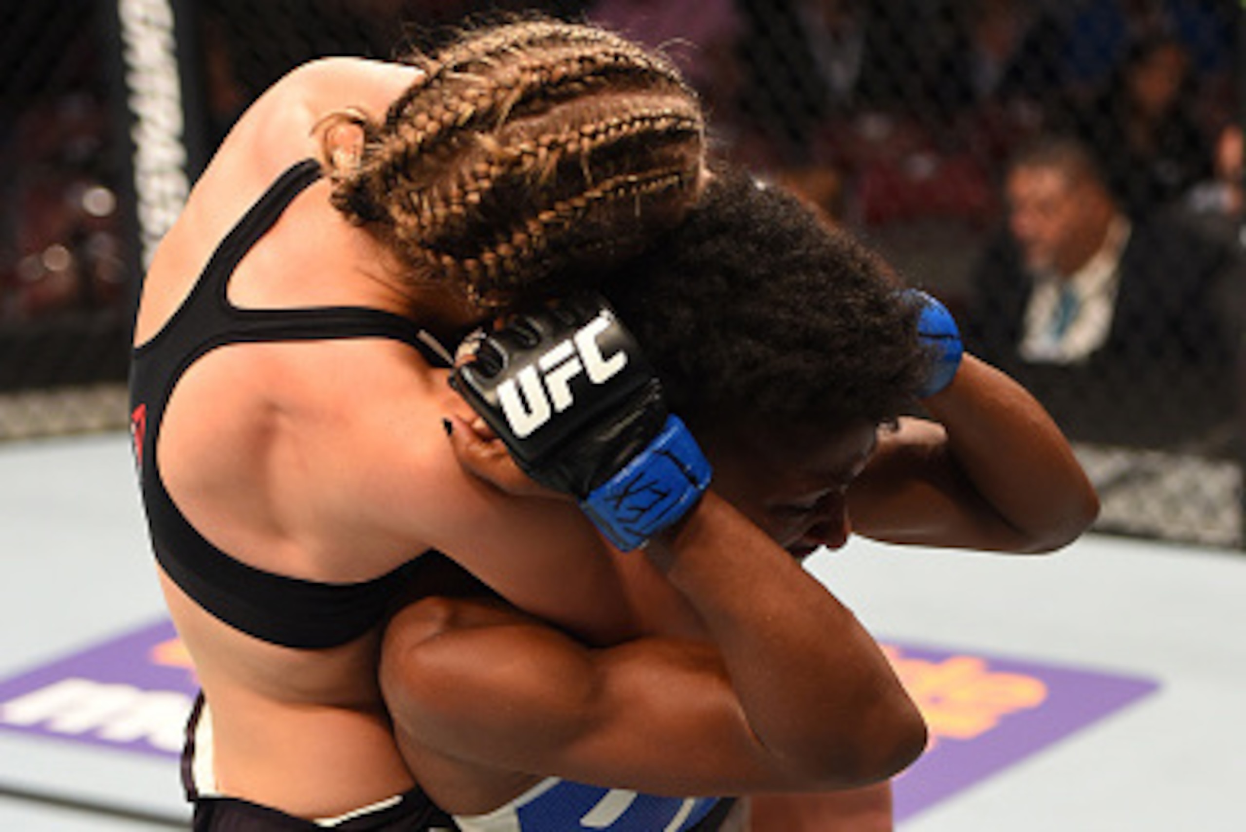 HOUSTON, TX - OCTOBER 03:  (L-R) Rose Namajunas attempts to submit Angela Hill in their women's strawweight bout during the UFC 192 event at the Toyota Center on October 3, 2015 in Houston, Texas. (Photo by Josh Hedges/Zuffa LLC/Zuffa LLC via Getty Images