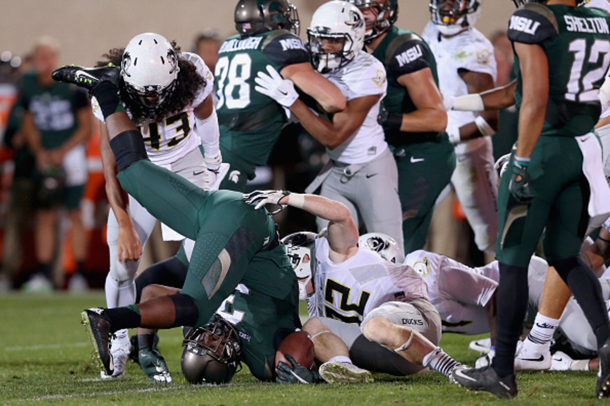 EAST LANSING, MI - SEPTEMBER 12:  L.J. Scott #3 of the Michigan State Spartans against the Oregon Ducks during their game at Spartan Stadium on September 12, 2015 in East Lansing, Michigan.  (Photo by Streeter Lecka/Getty Images)