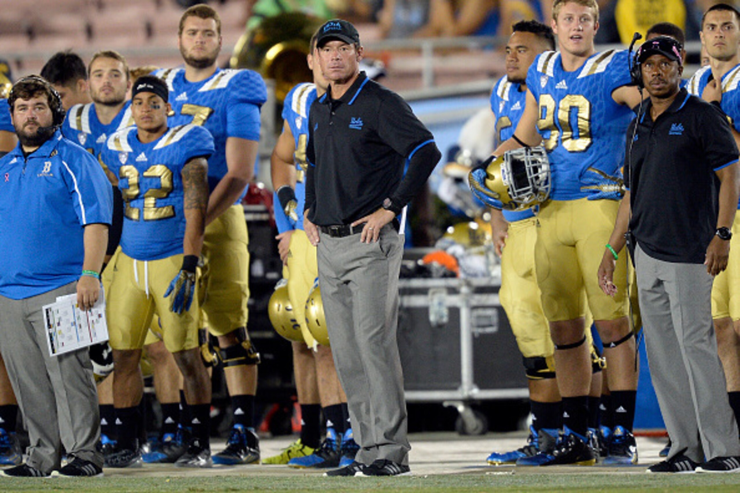 PASADENA, CA - OCTOBER 3: Coach Jim Mora (C) of the UCLA Bruins looks on from the sideline at the end of the college football after they lost to Arizona State Sun Devils, 38-23,  iat the Rose Bowl October 3, 2015, in Pasadena, California. Arizona State Su