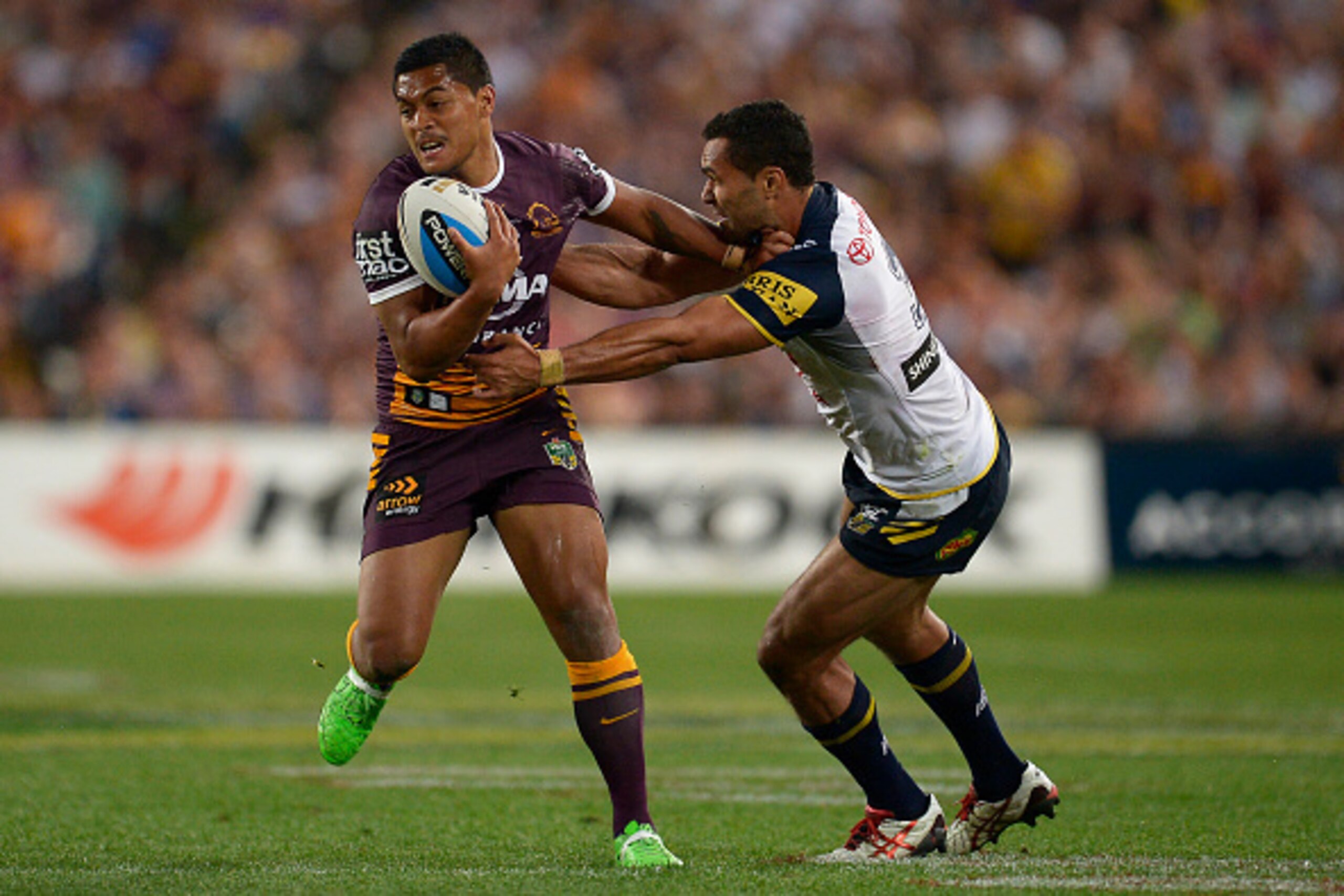 SYDNEY, AUSTRALIA - OCTOBER 04: Anthony Milford of the Broncos is tackled during the 2015 NRL Grand Final match between the Brisbane Broncos and the North Queensland Cowboys at ANZ Stadium on October 4, 2015 in Sydney, Australia.  (Photo by Brett Hemmings