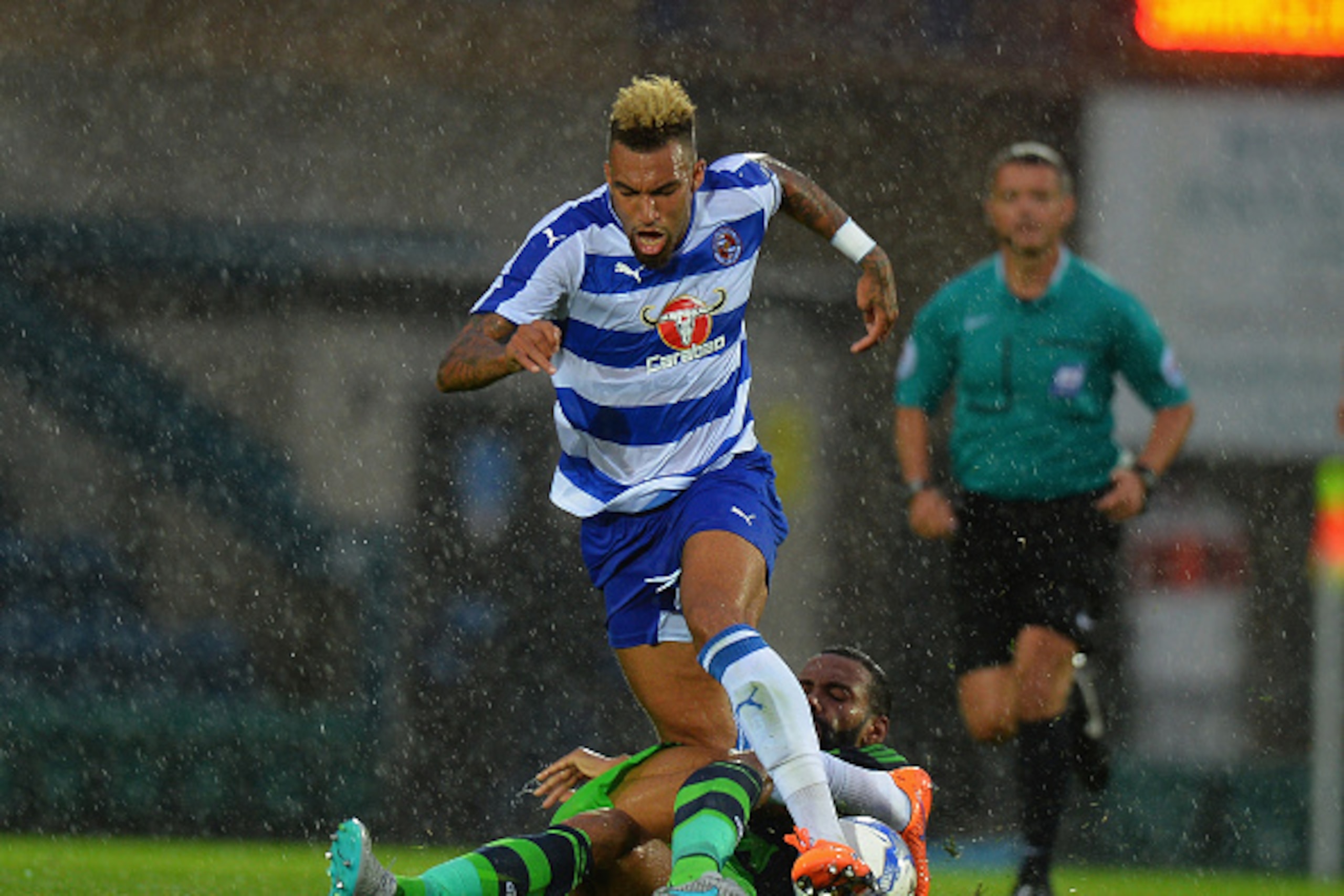 HIGH WYCOMBE, ENGLAND - JULY 24:  Kyle Bartley of Swansea City tackles Danny Williams of Reading during the Pre Season Friendly match between Reading and Swansea City at Adams Park on July 24, 2015 in High Wycombe, England.  (Photo by Tony Marshall/Getty 