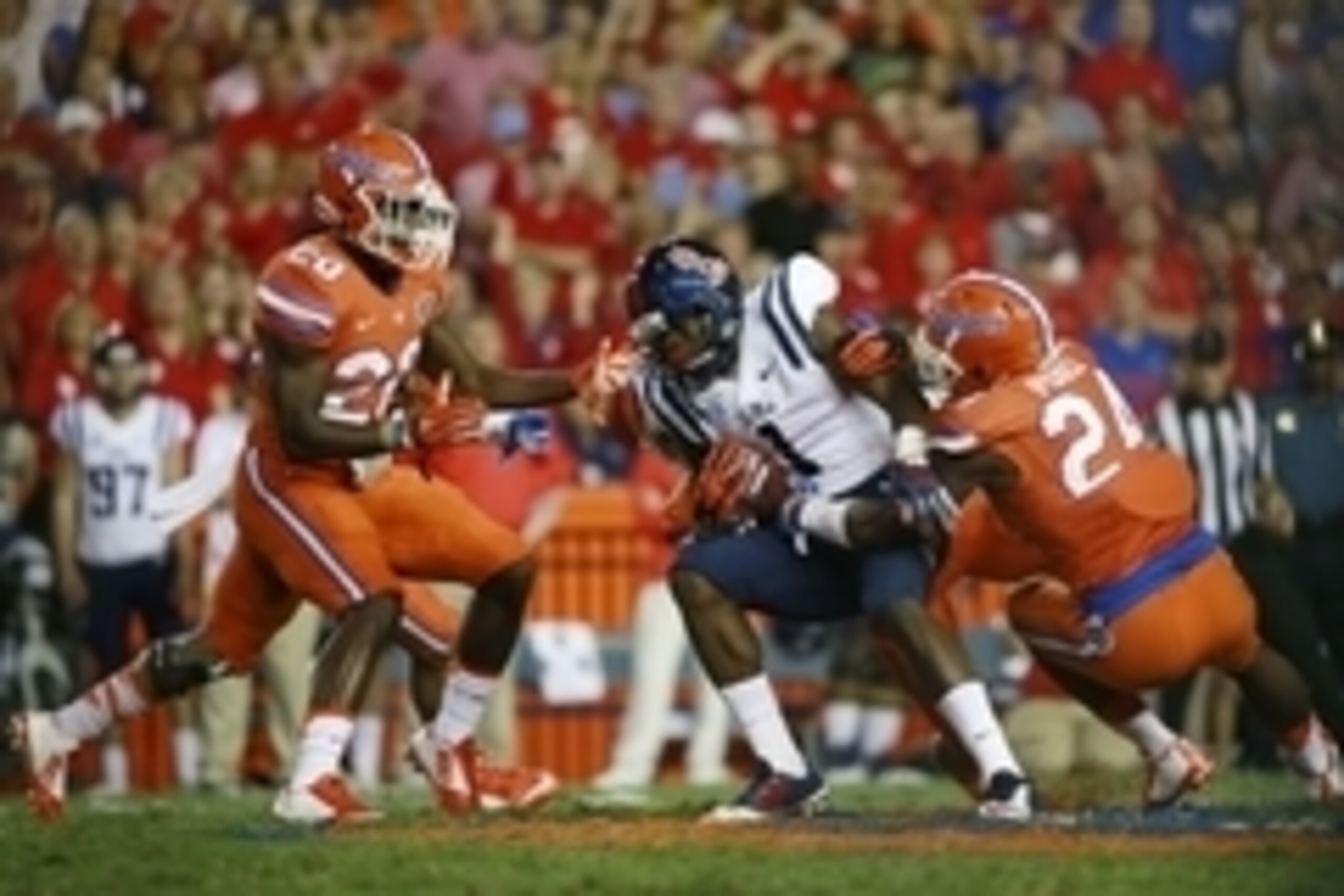 Oct 3, 2015; Gainesville, FL, USA; Mississippi Rebels wide receiver Laquon Treadwell (1) runs with the ball as Florida Gators defensive back Brian Poole (24)defends  during the first half at Ben Hill Griffin Stadium. Mandatory Credit: Kim Klement-USA TODA