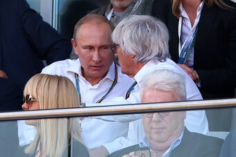 SOCHI, RUSSIA - OCTOBER 12:  F1 supremo Bernie Ecclestone speaks with Russian Resident Vladimir Putin during the Russian Formula One Grand Prix at Sochi Autodrom on October 12, 2014 in Sochi, Russia.  (Photo by Mark Thompson/Getty Images)