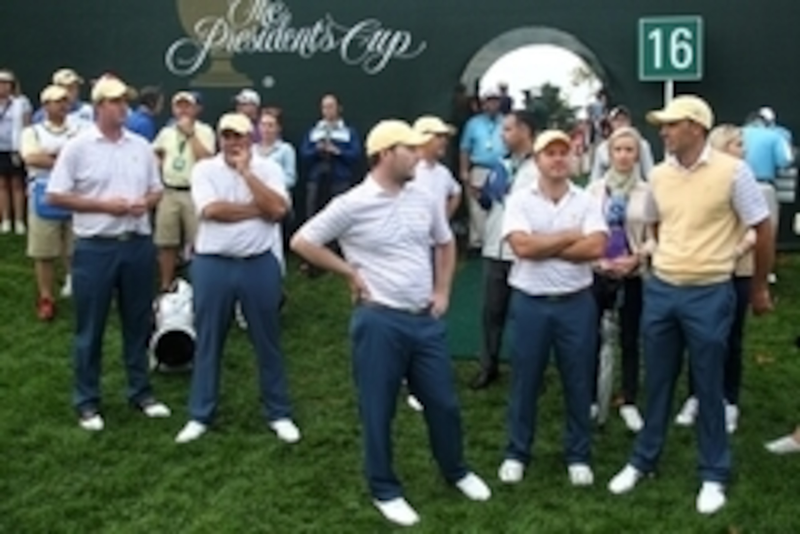 Oct 5, 2013; Dublin, OH, USA; Marc Leishman, Angel Cabrera, Brandon Grace, Richard Sterne and Charl Schwartzel on wait on the 16th green after the second round of the Presidents Cup at Muirfield Village Golf Club. Mandatory Credit: Brian Spurlock-USA TODA