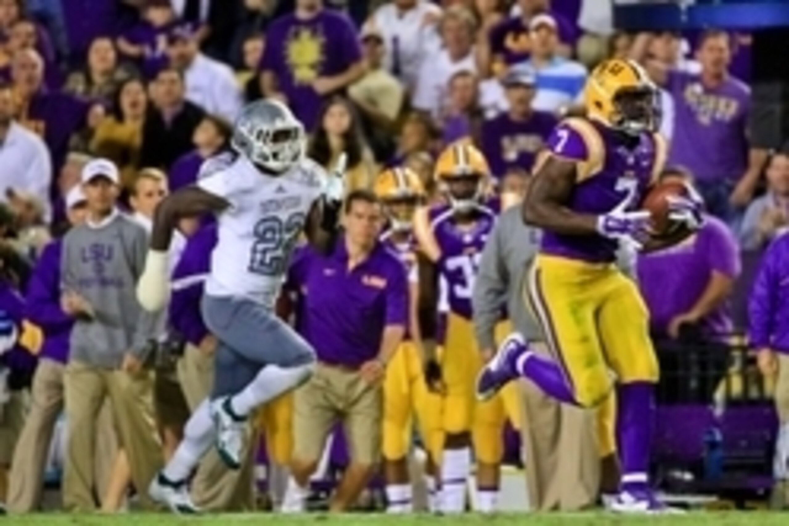 Oct 3, 2015; Baton Rouge, LA, USA; LSU Tigers running back Leonard Fournette (7) breaks away from Eastern Michigan Eagles defensive back Anthony Brown (22) running for a 75 yard touchdown during the third quarter of a game at Tiger Stadium. LSU defeated E