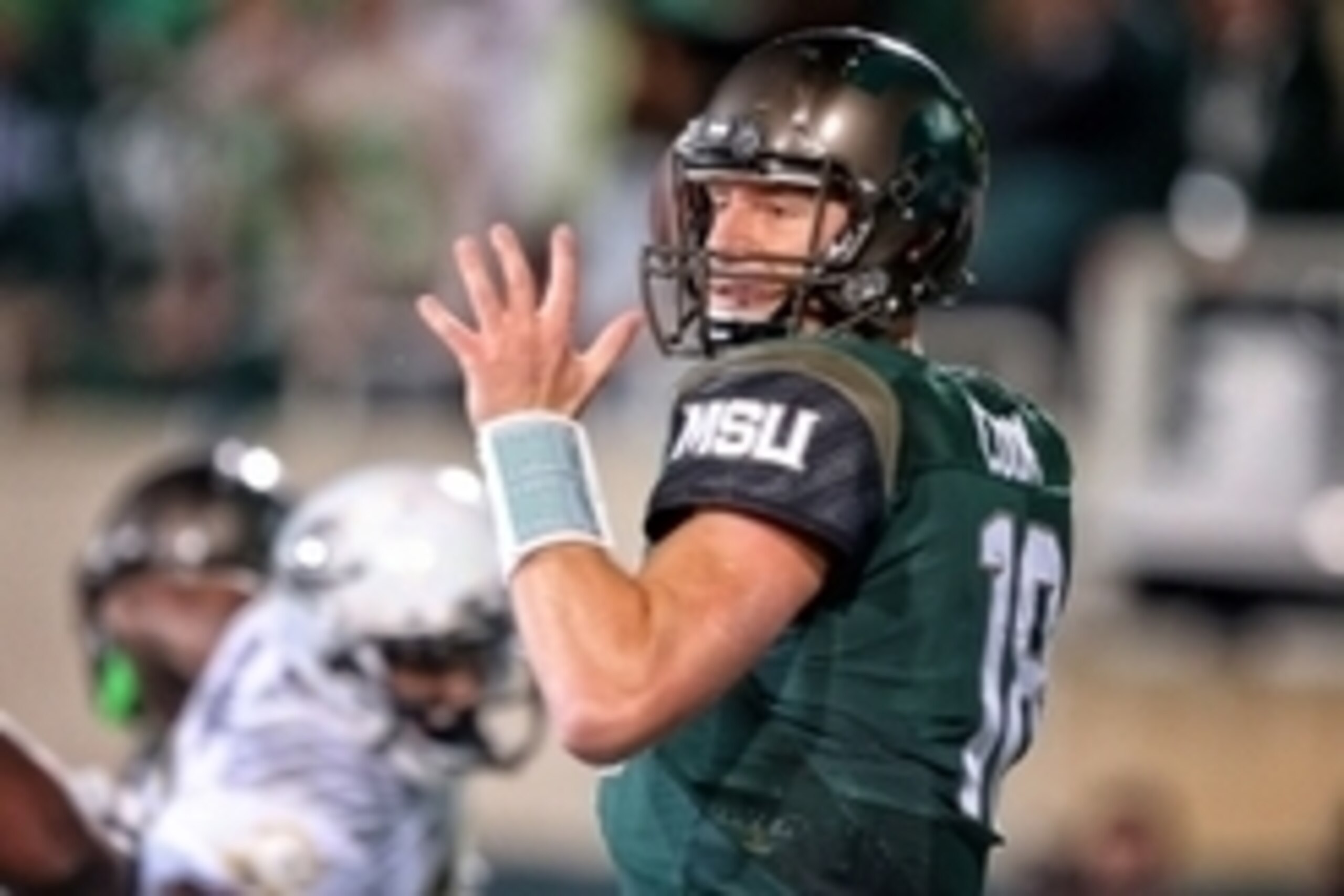 Sep 12, 2015; East Lansing, MI, USA; Michigan State Spartans quarterback Connor Cook (18) looks to throw the ball against the Oregon Ducks during the 1st half of a game at Spartan Stadium. Mandatory Credit: Mike Carter-USA TODAY Sports