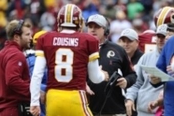 Oct 4, 2015; Landover, MD, USA; Washington Redskins quarterback Kirk Cousins (8) is congratulated by Washington Redskins head coach Jay Gruden after scoring a touchdown against the Philadelphia Eagles during the first half at FedEx Field. Mandatory Credit