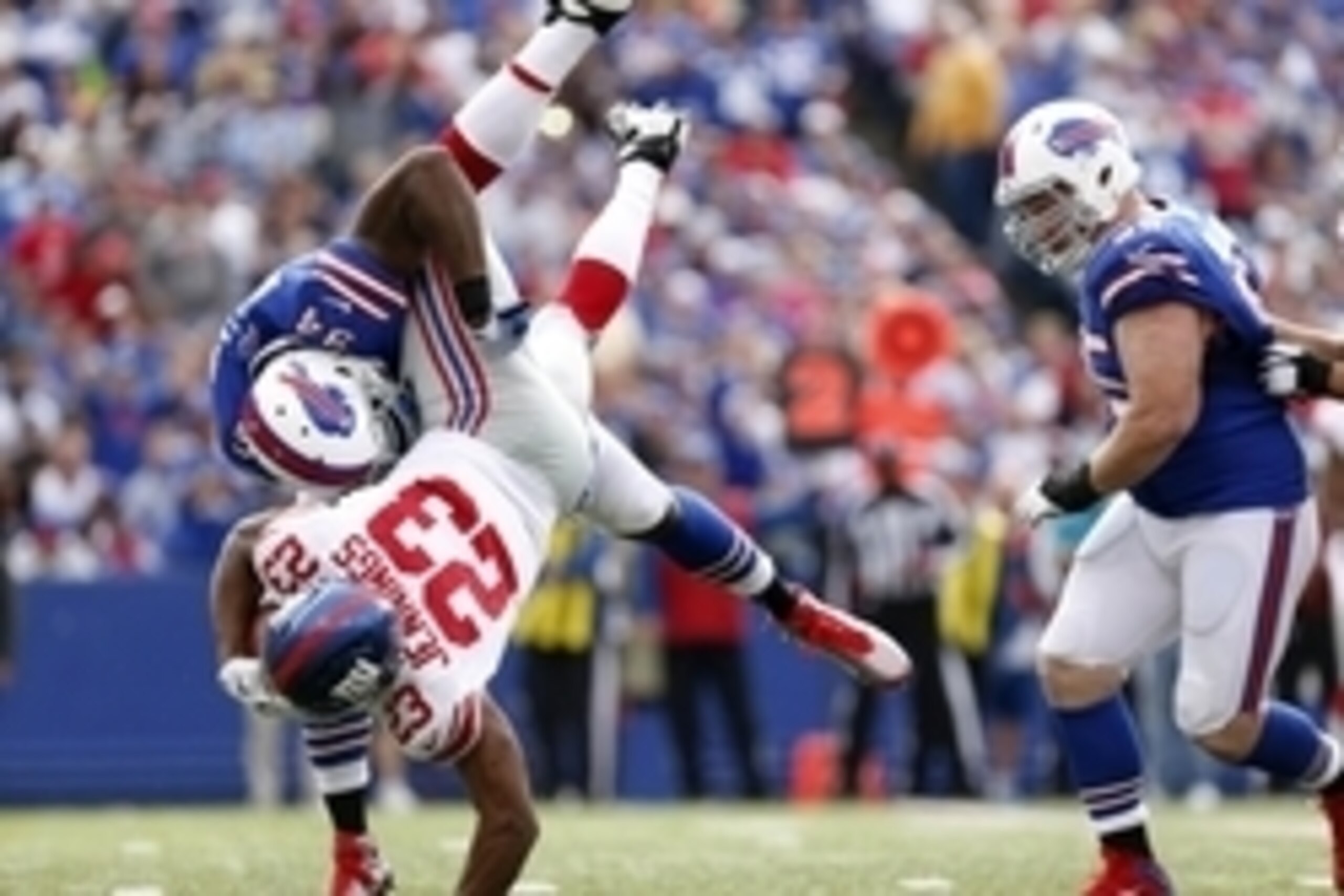 Oct 4, 2015; Orchard Park, NY, USA; Buffalo Bills defensive end Mario Williams (94) tackles New York Giants running back Rashad Jennings (23) during the second half at Ralph Wilson Stadium. Giants beat the Bills 24-10. Mandatory Credit: Kevin Hoffman-USA 