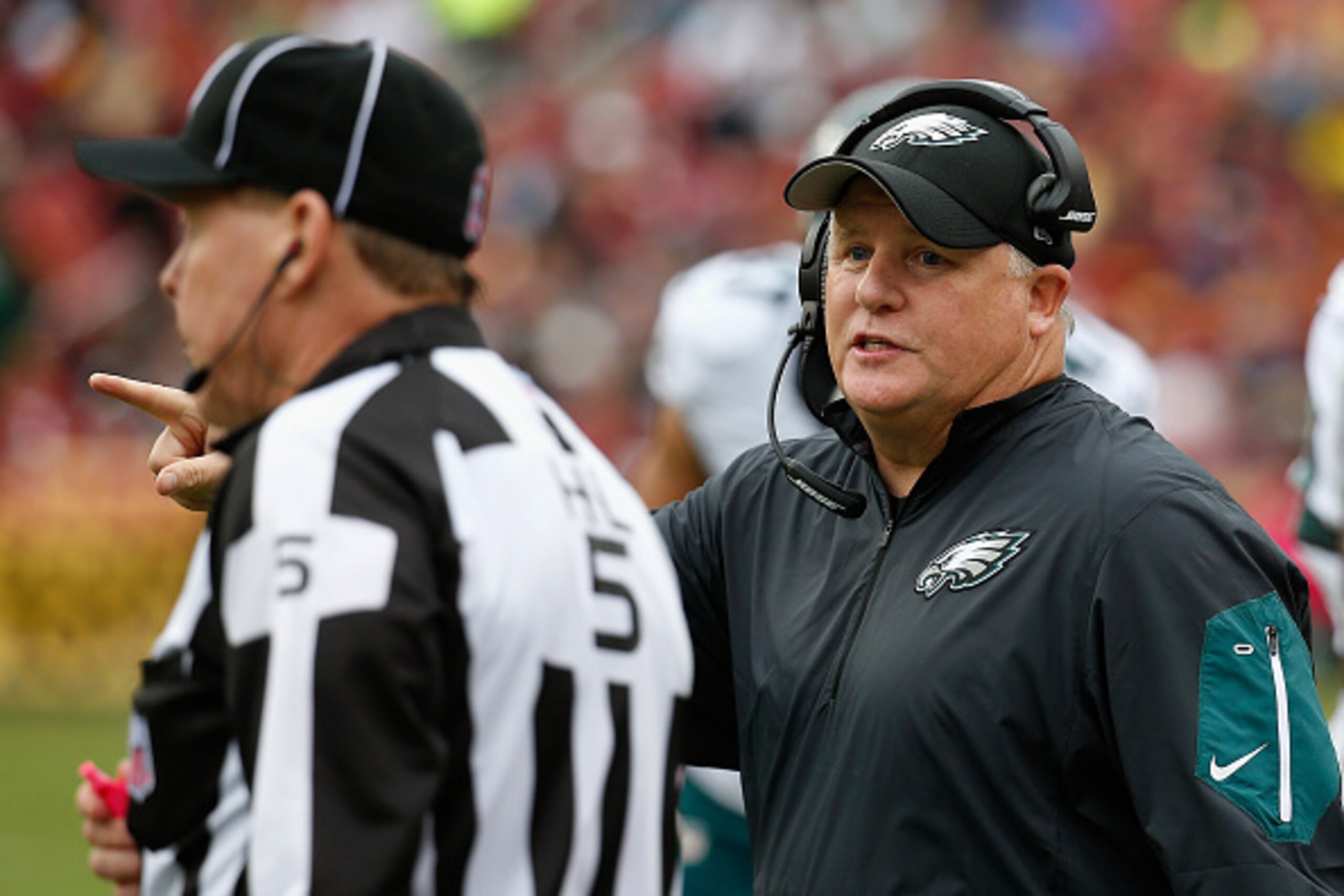 LANDOVER, MD - OCTOBER 04: Head coach Chip Kelly of the Philadelphia Eagles talks with an official during the second half of the Eagles 23-20 loss to the Washington Redskins at FedExField on October 4, 2015 in Landover, Maryland.  (Photo by Rob Carr/Getty