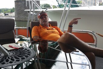 Kicked back on the front of his houseboat with a crossword puzzle is a familiar spot for Coy Caldwell.