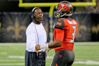 Sep 20, 2015; New Orleans, LA, USA;  Tampa Bay Buccaneers head coach Lovie Smith (L) talks to quarterback Jameis Winston (3) during the second half against the New Orleans Saints at the Mercedes-Benz Superdome. The Buccaneers won 26-19. Mandatory Credit: