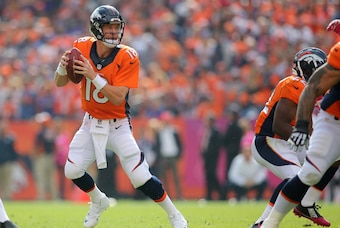 Oct 4, 2015; Denver, CO, USA; Denver Broncos quarterback Peyton Manning (18) looks to pass the ball during the first half against the Minnesota Vikings at Sports Authority Field at Mile High. Mandatory Credit: Chris Humphreys-USA TODAY Sports