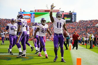 DENVER, CO - OCTOBER 4:  Wide receiver Mike Wallace #11 of the Minnesota Vikings celebrates after catching a pass for a second quarter touchdown against the Denver Broncos during a game at Sports Authority Field at Mile High on October 4, 2015 in Denver, 