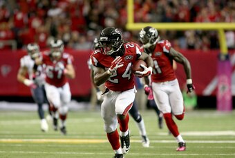 Oct 4, 2015; Atlanta, GA, USA; Atlanta Falcons running back Devonta Freeman (24) runs after a catch in the second quarter of their game against the Houston Texans at the Georgia Dome. The Falcons won 48-21. Mandatory Credit: Jason Getz-USA TODAY Sports