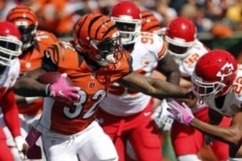 Oct 4, 2015; Cincinnati, OH, USA; Cincinnati Bengals running back Jeremy Hill (32) breaks a tackle from Kansas City Chiefs cornerback Marcus Peters (22) in the first half at Paul Brown Stadium. Mandatory Credit: Aaron Doster-USA TODAY Sports