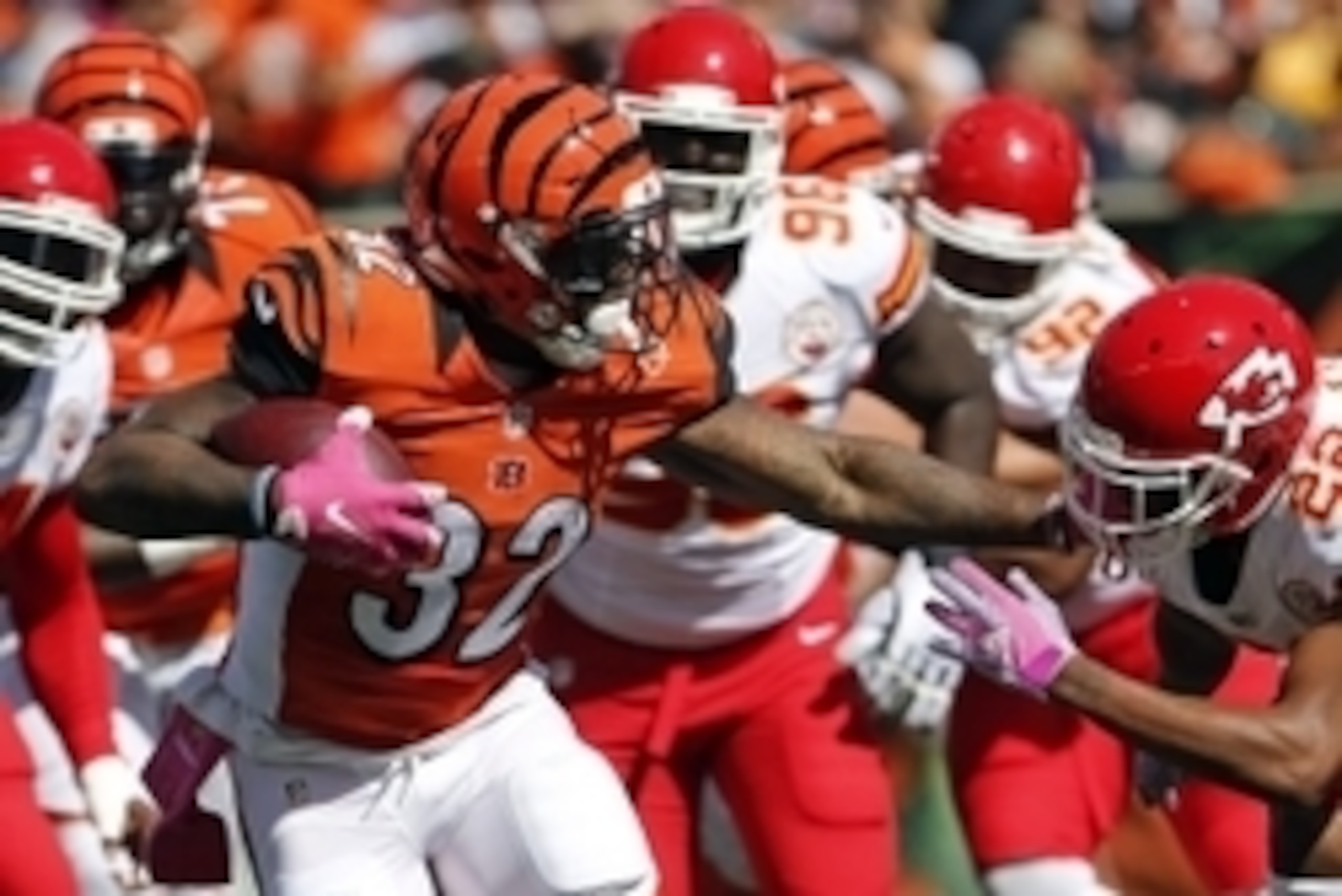 Oct 4, 2015; Cincinnati, OH, USA; Cincinnati Bengals running back Jeremy Hill (32) breaks a tackle from Kansas City Chiefs cornerback Marcus Peters (22) in the first half at Paul Brown Stadium. Mandatory Credit: Aaron Doster-USA TODAY Sports