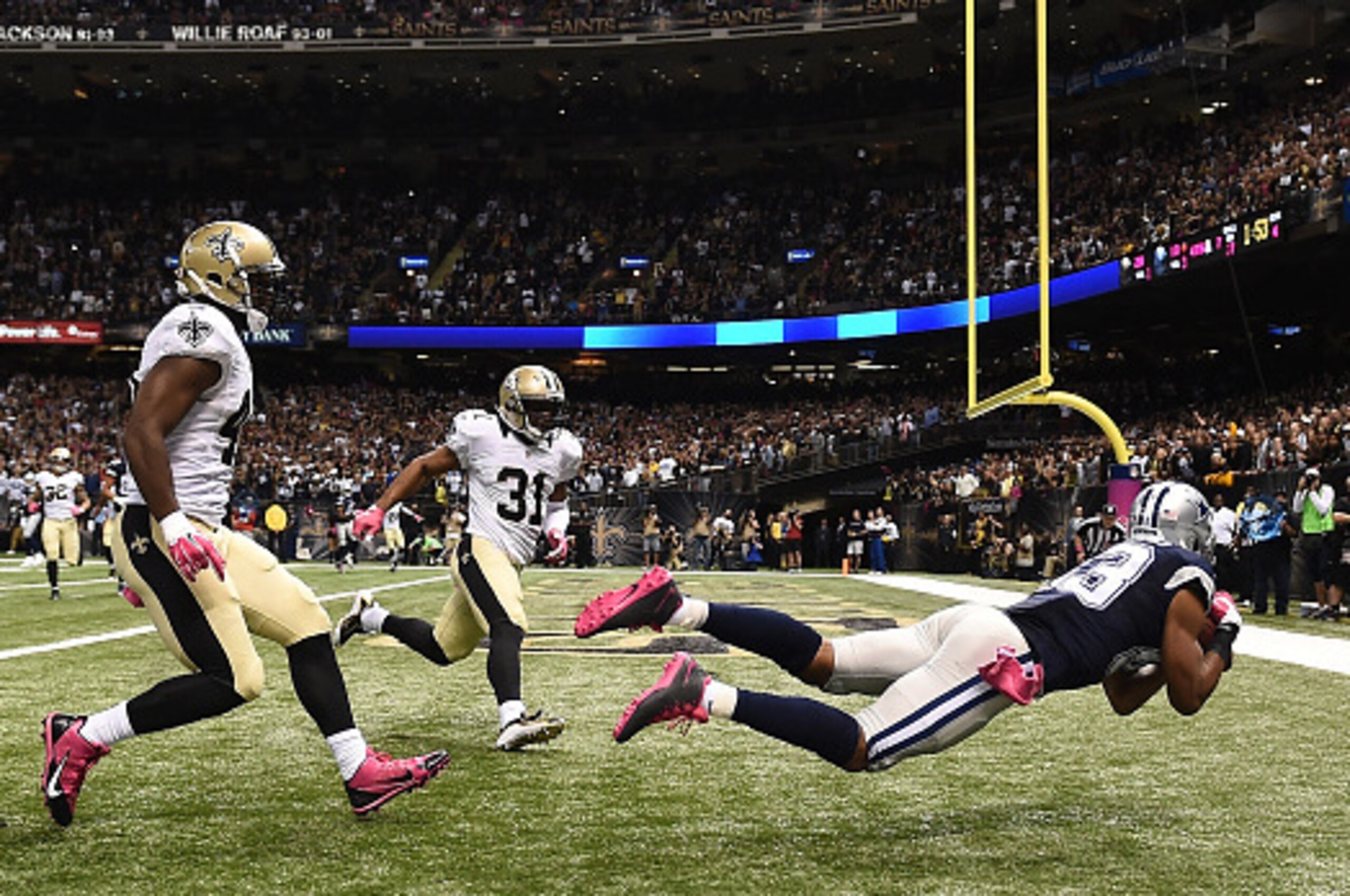 NEW ORLEANS, LA - OCTOBER 04:  Terrance Williams #83 of the Dallas Cowboys scores a touchdown during the fourth quarter against the New Orleans Saints at Mercedes-Benz Superdome on October 4, 2015 in New Orleans, Louisiana.  (Photo by Stacy Revere/Getty I