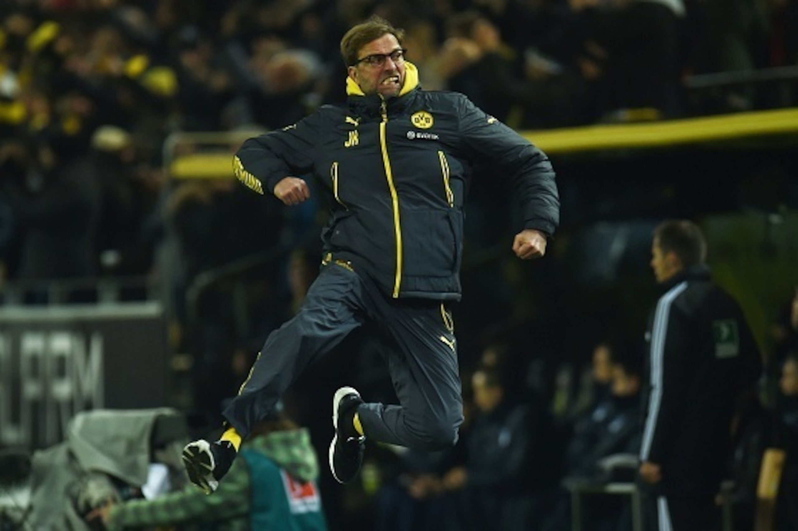 Dortmund's head coach Juergen Klopp celebrates after Dortmund's midfielder Ilkay Guendogan scored the 1-0 goal during the German first division Bundesliga football match Borussia Dortmund vs 1899 Hoffenheim in Dortmund, western germany  on December 5, 201