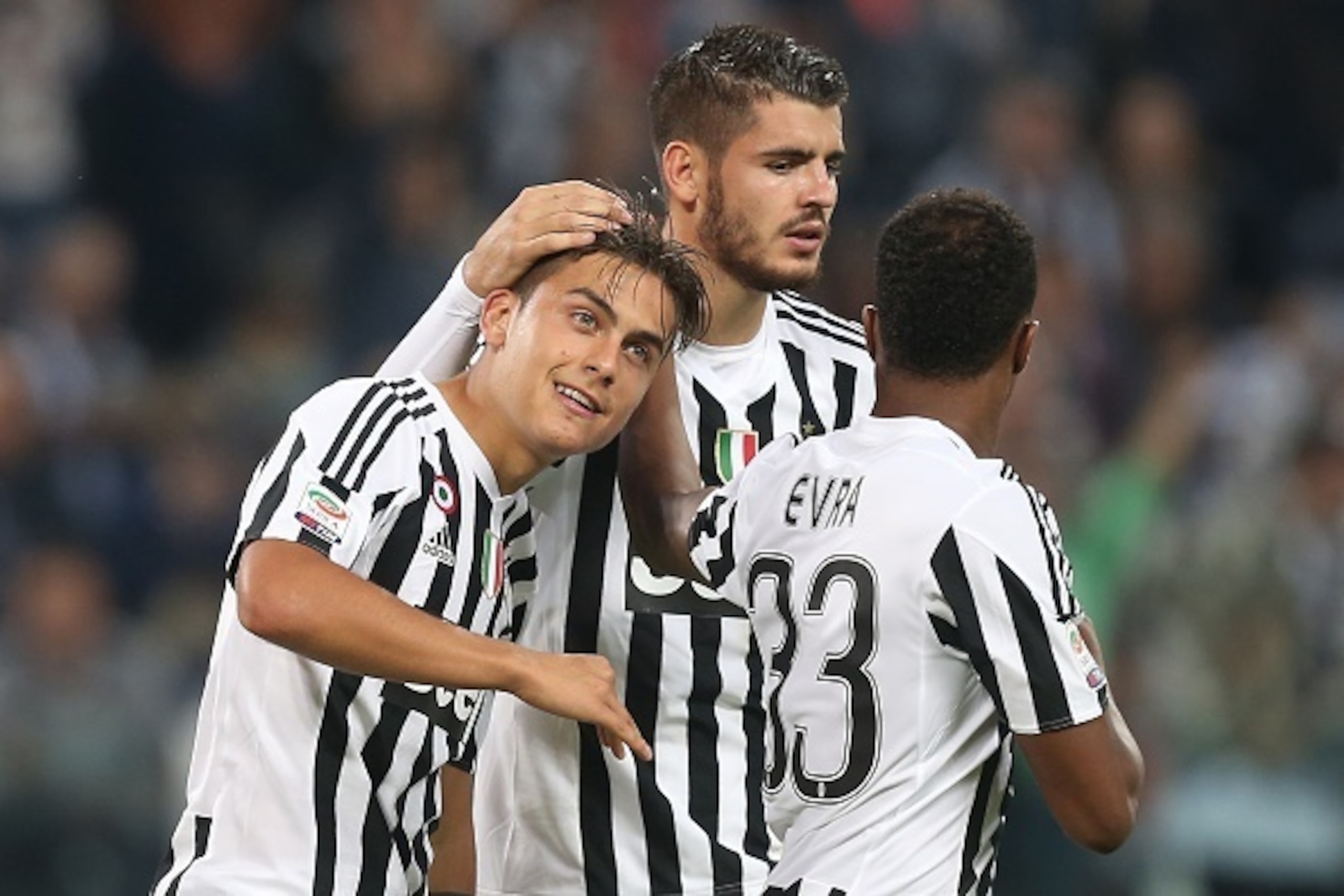 Juventus' forward Paulo Dybala from Argentina celebrates after scoring with his teammate Juventus' forward Alvaro Morata from Spain during the Italian Serie A  football match Juventus Vs Bologna on October 4, 2015 at the 'Juventus Stadium' in Turin.  AFP 