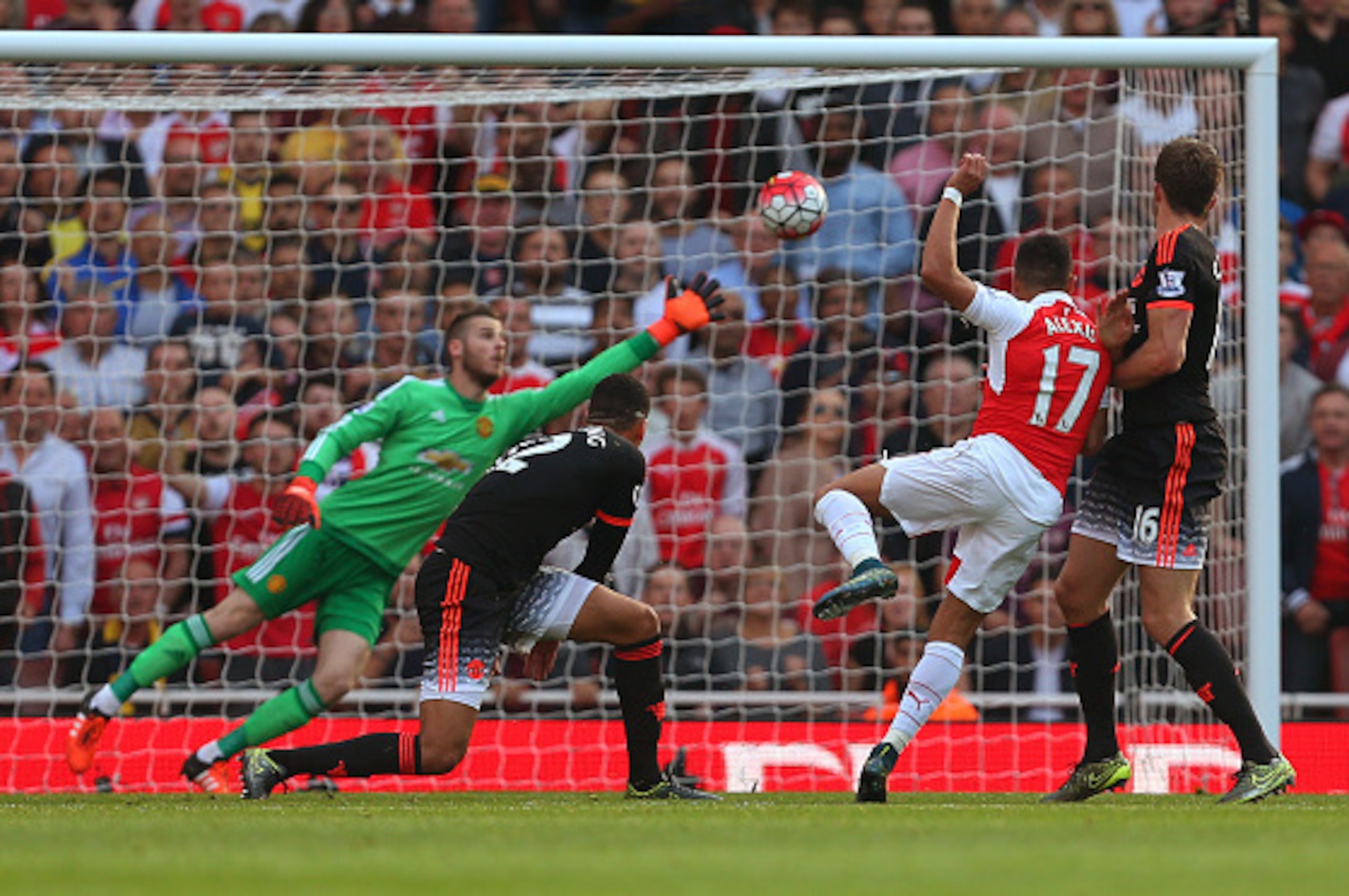 LONDON, ENGLAND - OCTOBER 04:  Alexis Sanchez of Arsenal scores a goal to make it 3-0  during the Barclays Premier League match between Arsenal and Manchester United at the Emirates Stadium on October 04, 2015 in London, United Kingdom.  (Photo by Catheri