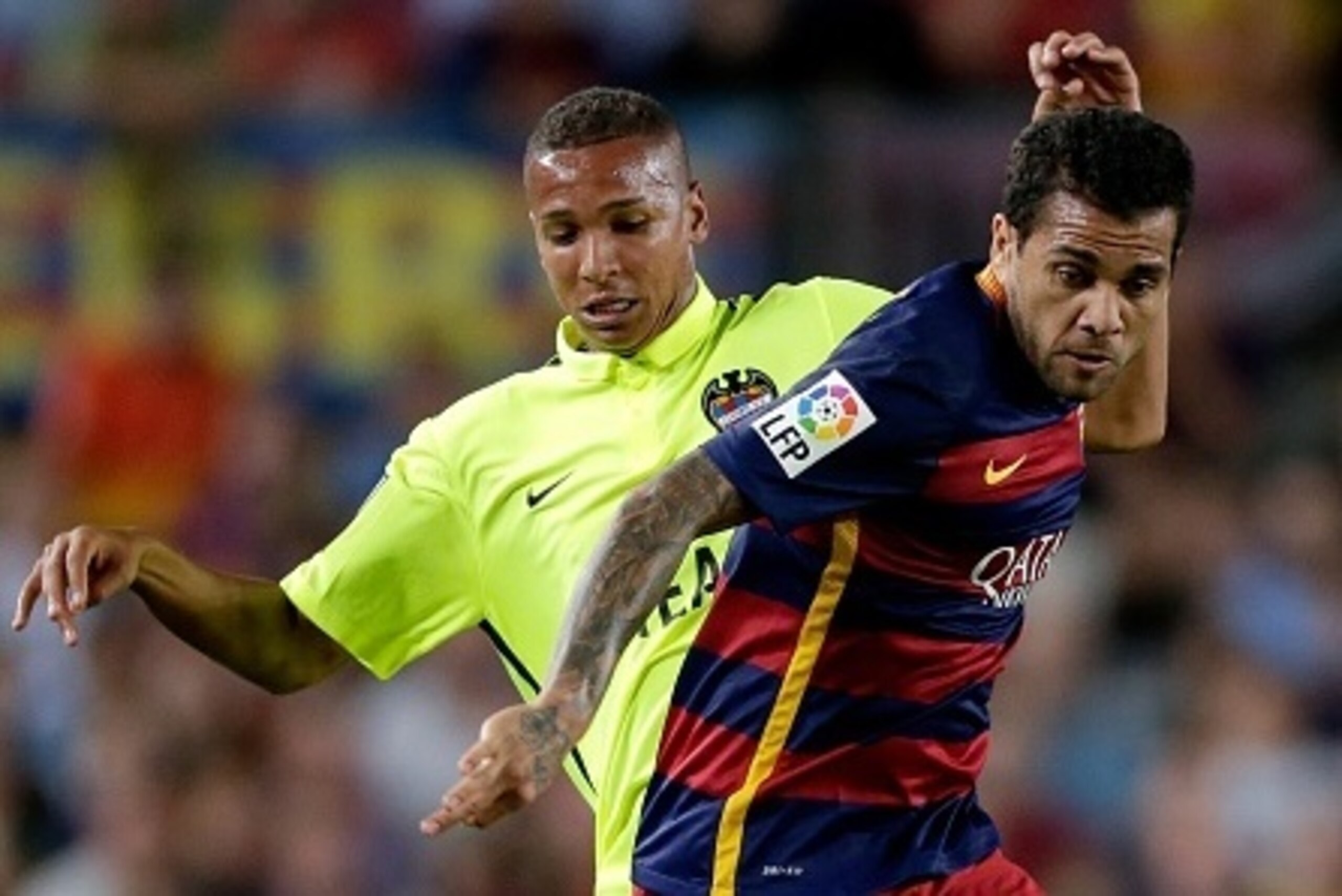 (L-R) Deyverson of Levante UD, Daniel Dani Alves of FC Barcelona during the Primera Division match between FC Barcelona and Levante UD on September 20, 2015 at Camp Nou stadium in Barcelona, Spain.(Photo by VI Images via Getty Images)
