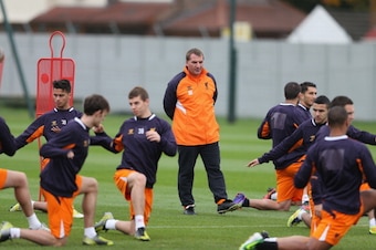 LIVERPOOL, ENGLAND - OCTOBER 24:  Liverpool manager Brendan Rodgers watches his players during a training session ahead of their UEFA Europa League group match against FC Anzhi Makhachkala at Melwood Training Ground on October 24, 2012 in Liverpool, Engla