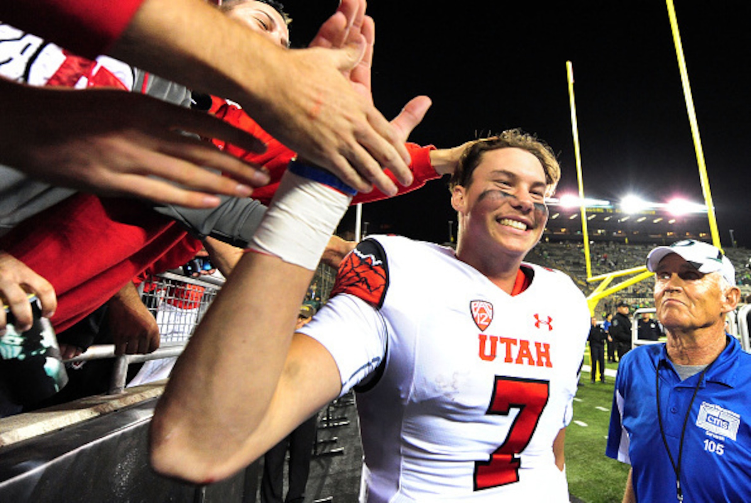 EUGENE, OR - SEPTEMBER 26: Quarterback Travis Wilson #7 of the Utah Utes celebrate with fans after the Utah Utes beat the Oregon Ducks 62-20 at Autzen Stadium on September 26, 2015 in Eugene, Oregon. (Photo by Steve Dykes/Getty Images) EUGENE, OR - SEPTEMBER 26: Quarterback Travis Wilson #7 of the Utah Utes celebrate with fans after the Utah Utes beat the Oregon Ducks 62-20 at Autzen Stadium on September 26, 2015 in Eugene, Oregon. (Photo by Steve Dykes/Getty Images)
