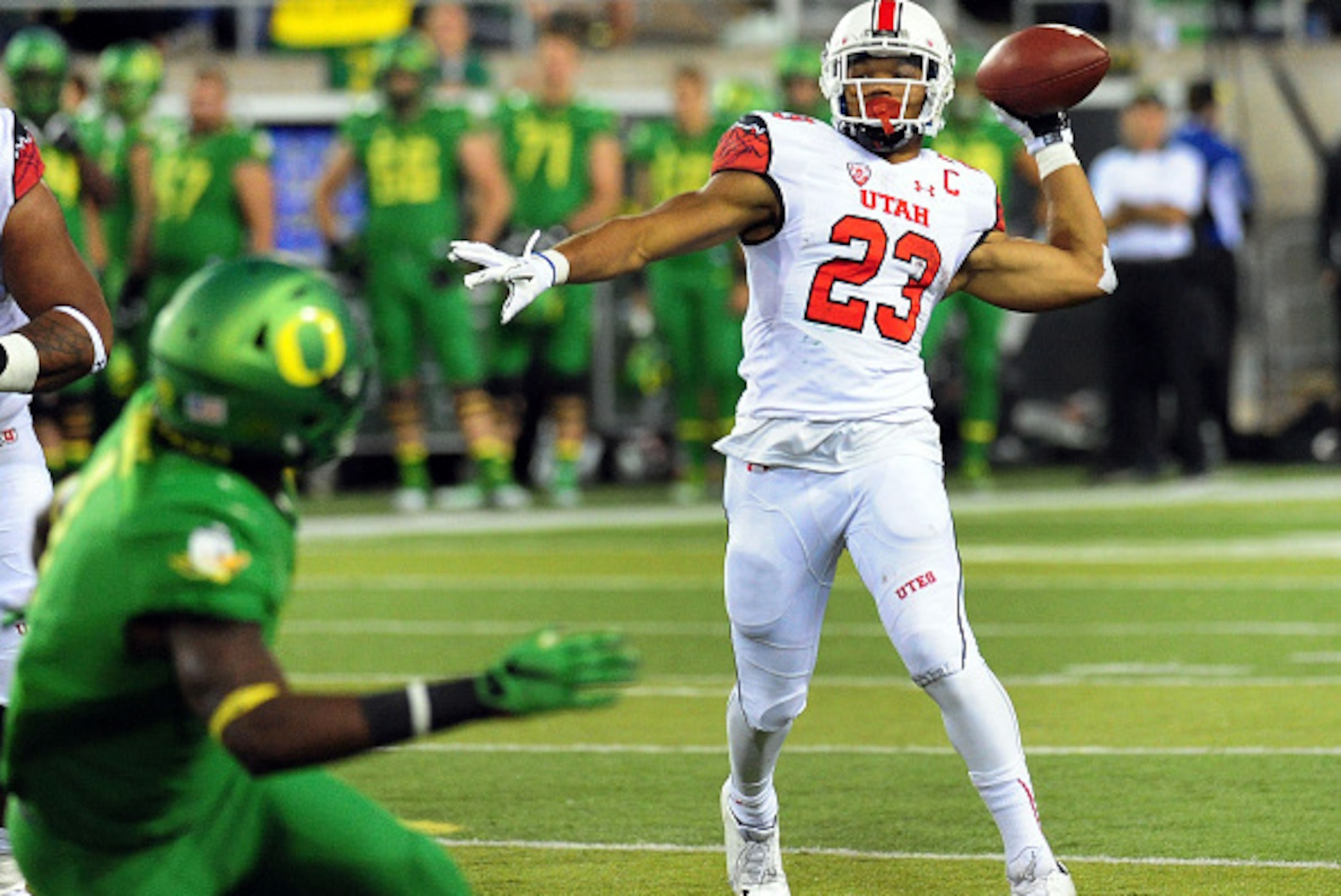 EUGENE, OR - SEPTEMBER 26: Running back Devontae Booker #23 of the Utah Utes thows a touchdown pass in the third quarter of the game against the Oregon Ducks at Autzen Stadium on September 26, 2015 in Eugene, Oregon. (Photo by Steve Dykes/Getty Images) EUGENE, OR - SEPTEMBER 26: Running back Devontae Booker #23 of the Utah Utes thows a touchdown pass in the third quarter of the game against the Oregon Ducks at Autzen Stadium on September 26, 2015 in Eugene, Oregon. (Photo by Steve Dykes/Getty Images)