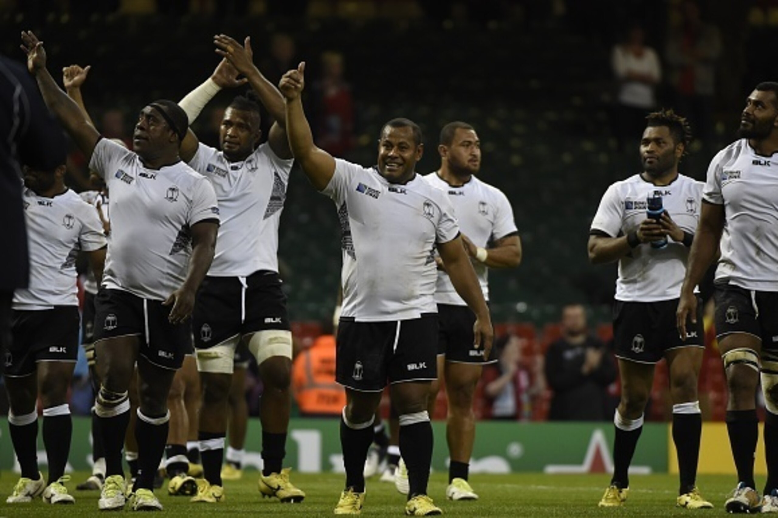 Fiji's players gesture after  a Pool A match of the 2015 Rugby World Cup between Wales and Fiji at the Millennium stadium in Cardiff, south Wales, on October 1, 2015.  AFP PHOTO / LOIC VENANCE

RESTRICTED TO EDITORIAL USE, NO USE IN LIVE MATCH TRACKING SE