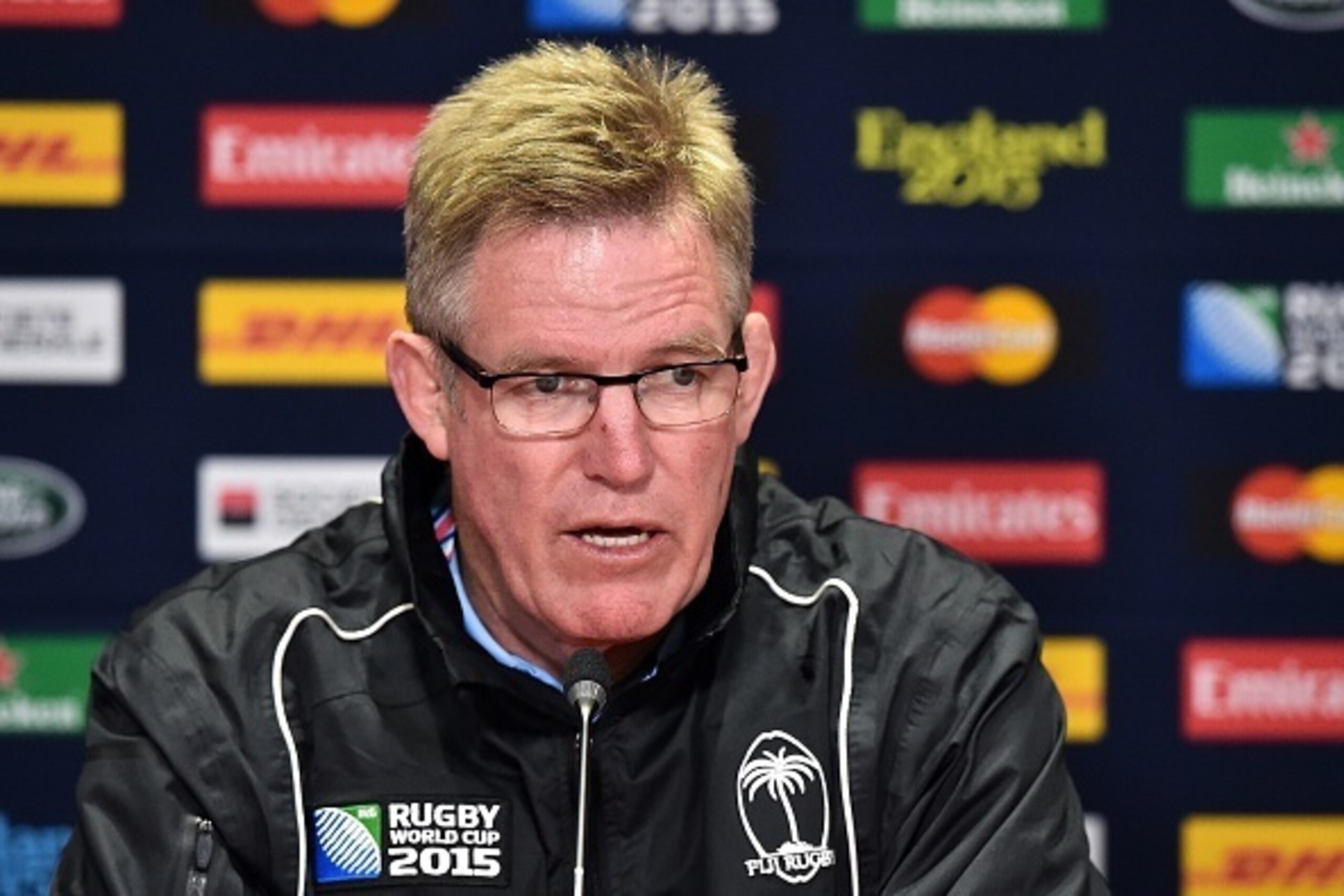 Fiji's New Zealand head coach John McKee attends a press conference in Cardiff, south Wales, on September 30, 2015, during the 2015 Rugby World Cup.    AFP PHOTO / GABRIEL BOUYS 

RESTRICTED TO EDITORIAL USE        (Photo credit should read GABRIEL BOUYS/