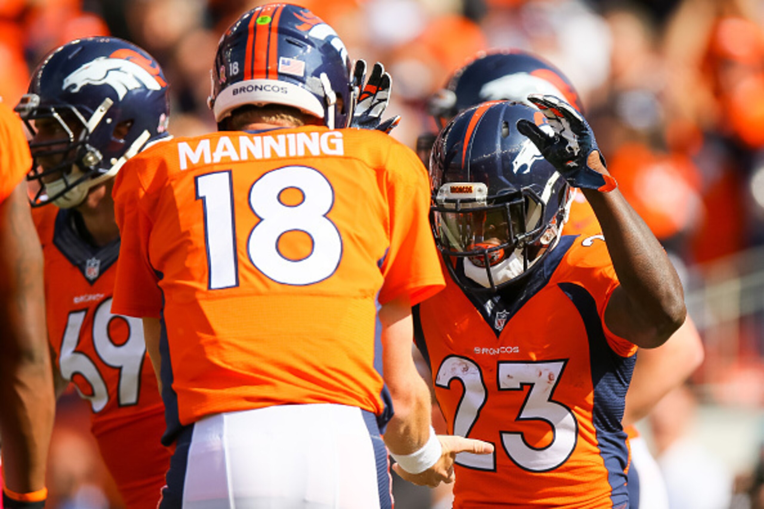 DENVER, CO - OCTOBER 4:  Running back Ronnie Hillman #23 of the Denver Broncos celebrates with Peyton Manning #18 after scoring a touchdown on an 72 yard rush in the second quarter of a game against the Minnesota Vikings at Sports Authority Field at Mile 