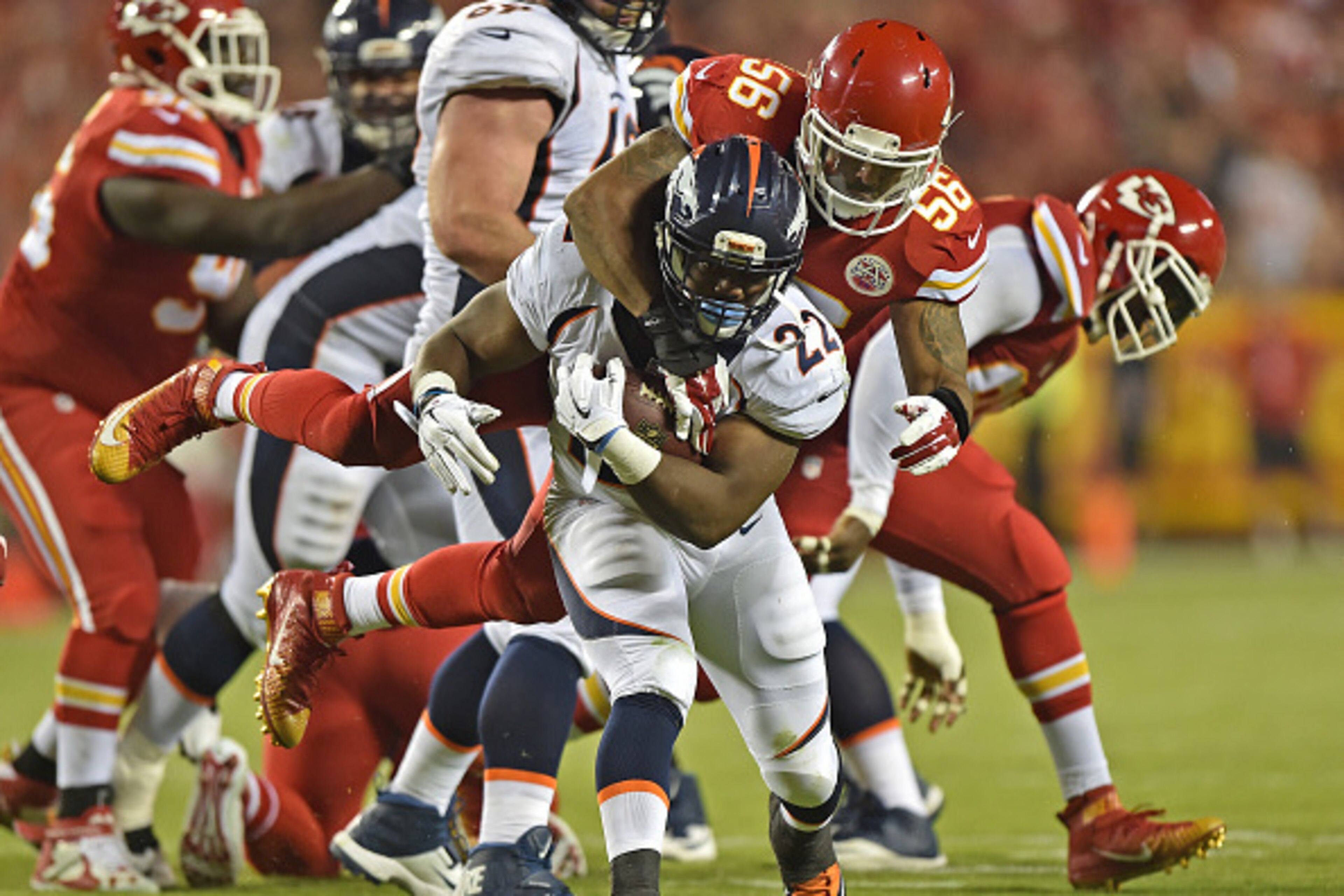 KANSAS CITY, MO - SEPTEMBER 17:  Linebacker Derrick Johnson #56 of the Kansas City Chiefs tackles running back C.J. Anderson #22 of the Denver Broncos during the first half at Arrowhead Stadium on September 17, 2015 in Kansas City, Missouri.  (Photo by Pe