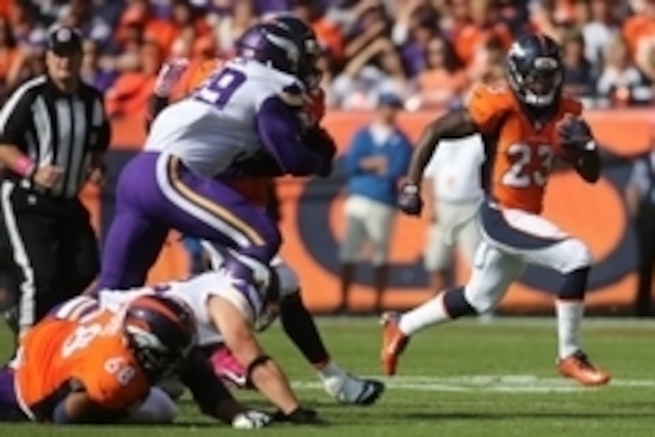 Oct 4, 2015; Denver, CO, USA; Denver Broncos running back Ronnie Hillman (23) runs for a touchdown during the first half against the Minnesota Vikings at Sports Authority Field at Mile High. Mandatory Credit: Chris Humphreys-USA TODAY Sports