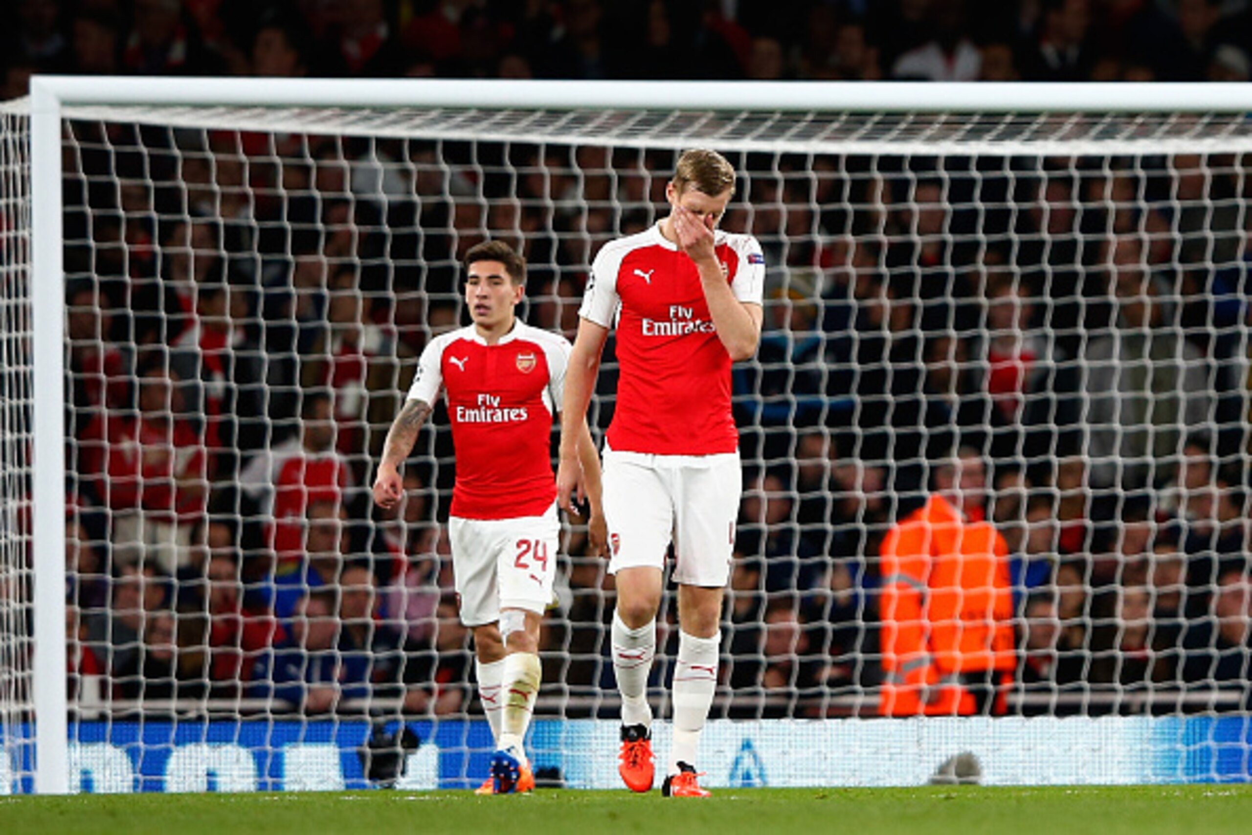 LONDON, ENGLAND - SEPTEMBER 29: Per Mertesacker of Arsenal reacts after the third  Olympiacos goal during the UEFA Champions League Group F match between Arsenal FC and Olympiacos FC at the Emirates Stadium on September 29, 2015 in London, United Kingdom.