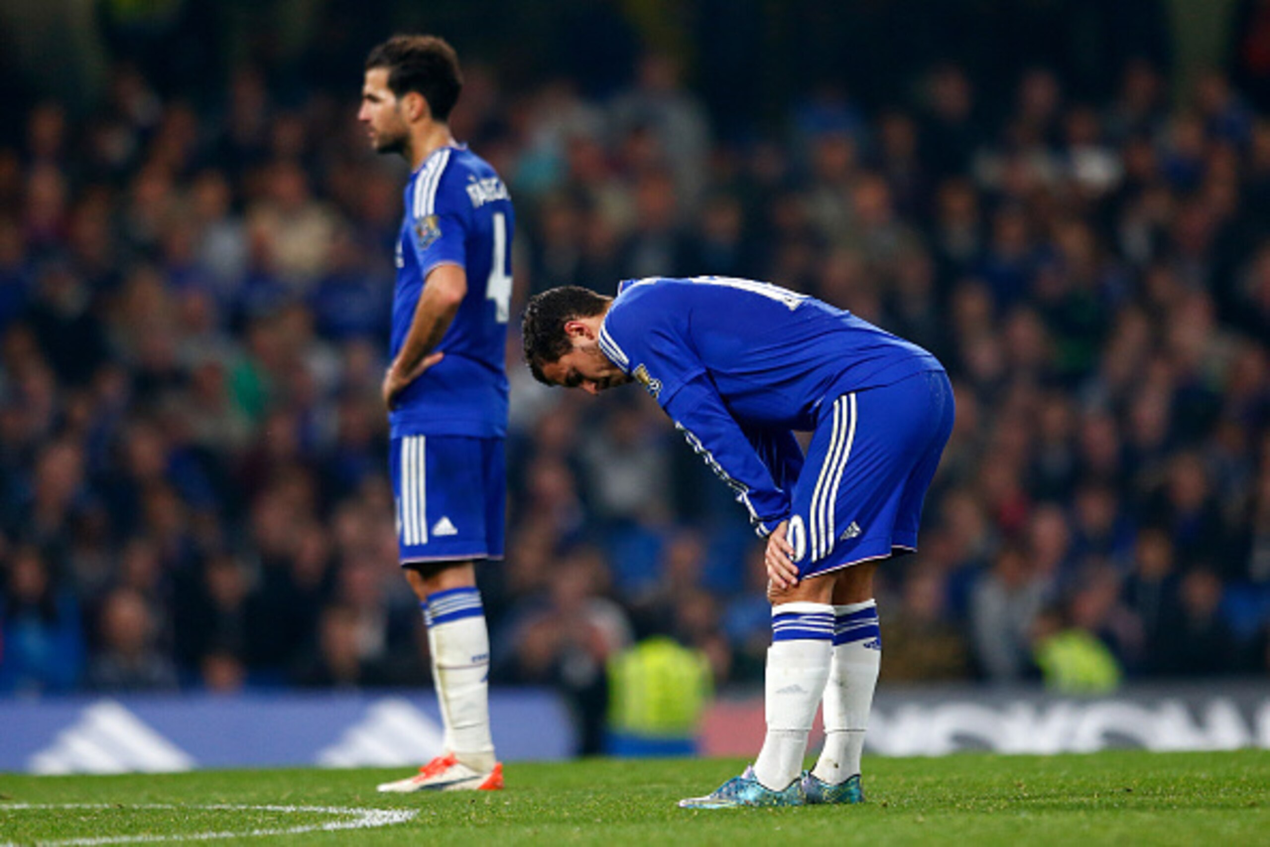 LONDON, ENGLAND - OCTOBER 03:  Eden Hazard of Chelsea and Sesc Fabregas of Chelsea show their dejection after conceding the third goal to Southampton during the Barclays Premier League match between Chelsea and Southampton at Stamford Bridge on October 3,