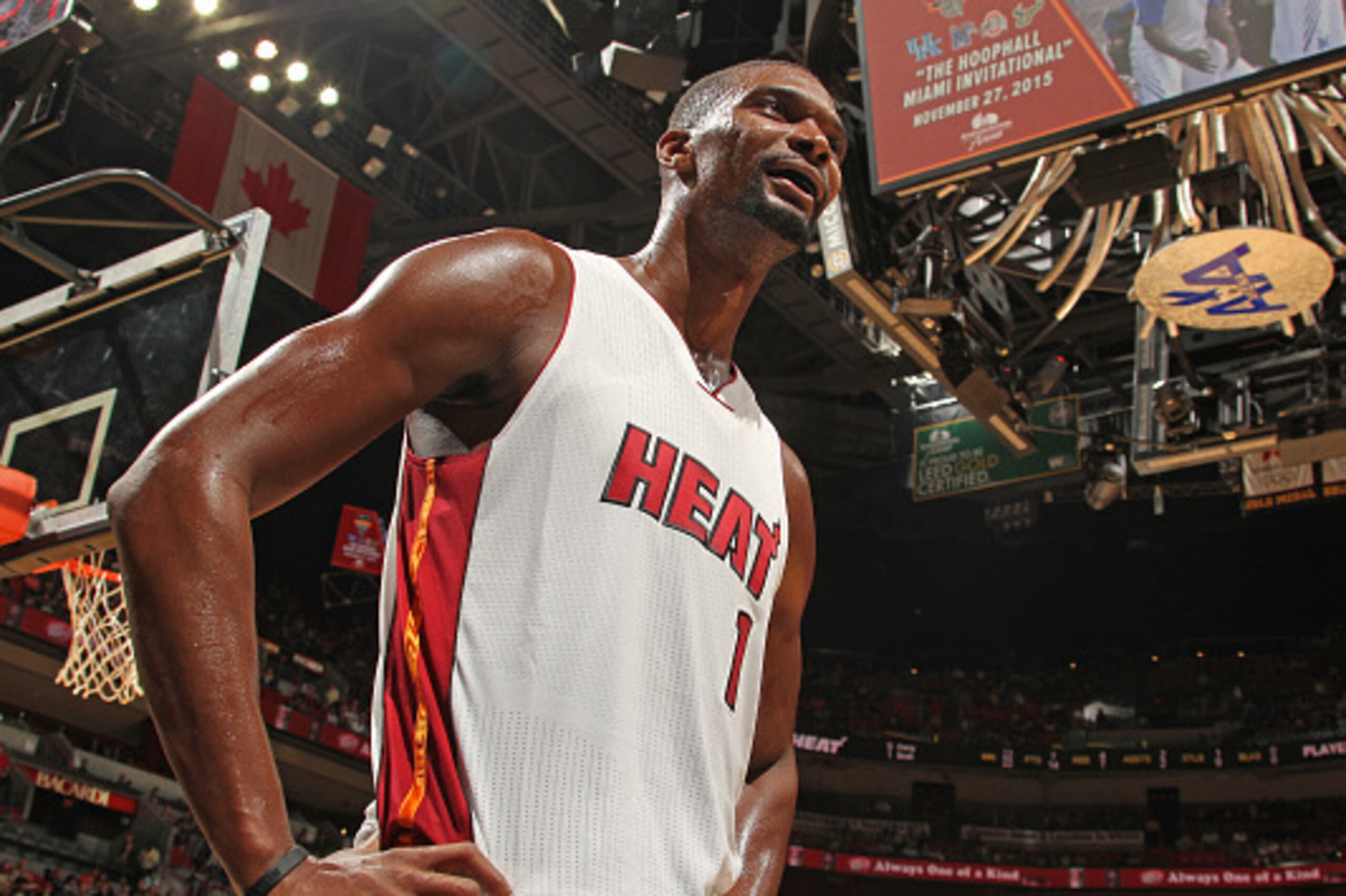 MIAMI, FL - OCTOBER 4: Chris Bosh #1 of the Miami Heat looks on against the Charlotte Hornets during the preseason game on October 4, 2015 at AmericanAirlines Arena in Miami, Florida. NOTE TO USER: User expressly acknowledges and agrees that, by download MIAMI, FL - OCTOBER 4: Chris Bosh #1 of the Miami Heat looks on against the Charlotte Hornets during the preseason game on October 4, 2015 at AmericanAirlines Arena in Miami, Florida. NOTE TO USER: User expressly acknowledges and agrees that, by download