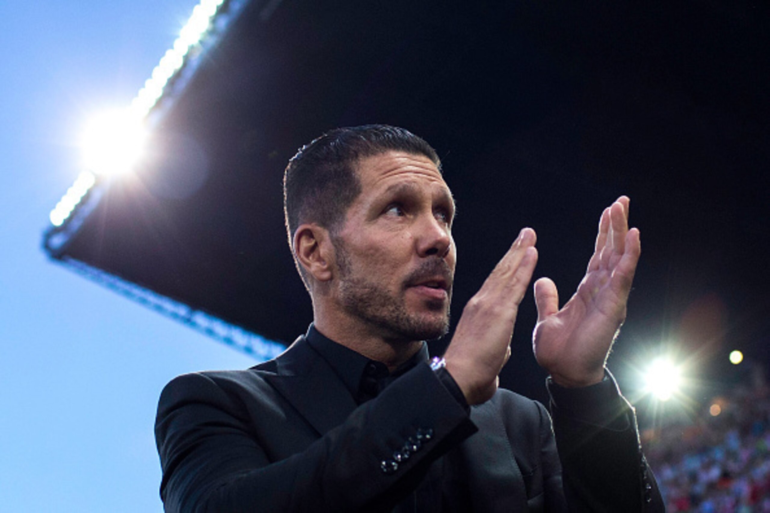 MADRID, SPAIN - SEPTEMBER 12: Head coach Diego Pablo Simeone of Atletico de Madrid applauds the fans as he walks to the bench prior to start during the La Liga match between Club Atletico de Madrid and FC Barcelona at Vicente Calderon Stadium on September