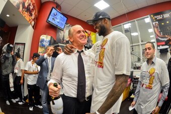 MIAMI, FL - JUNE 20: LeBron James #6 of the Miami Heat celebrates with team President Pat Riley in the locker room following the Heat's victory against the San Antonio Spurs in Game Seven of the 2013 NBA Finals on June 20, 2013 at American Airlines Arena 