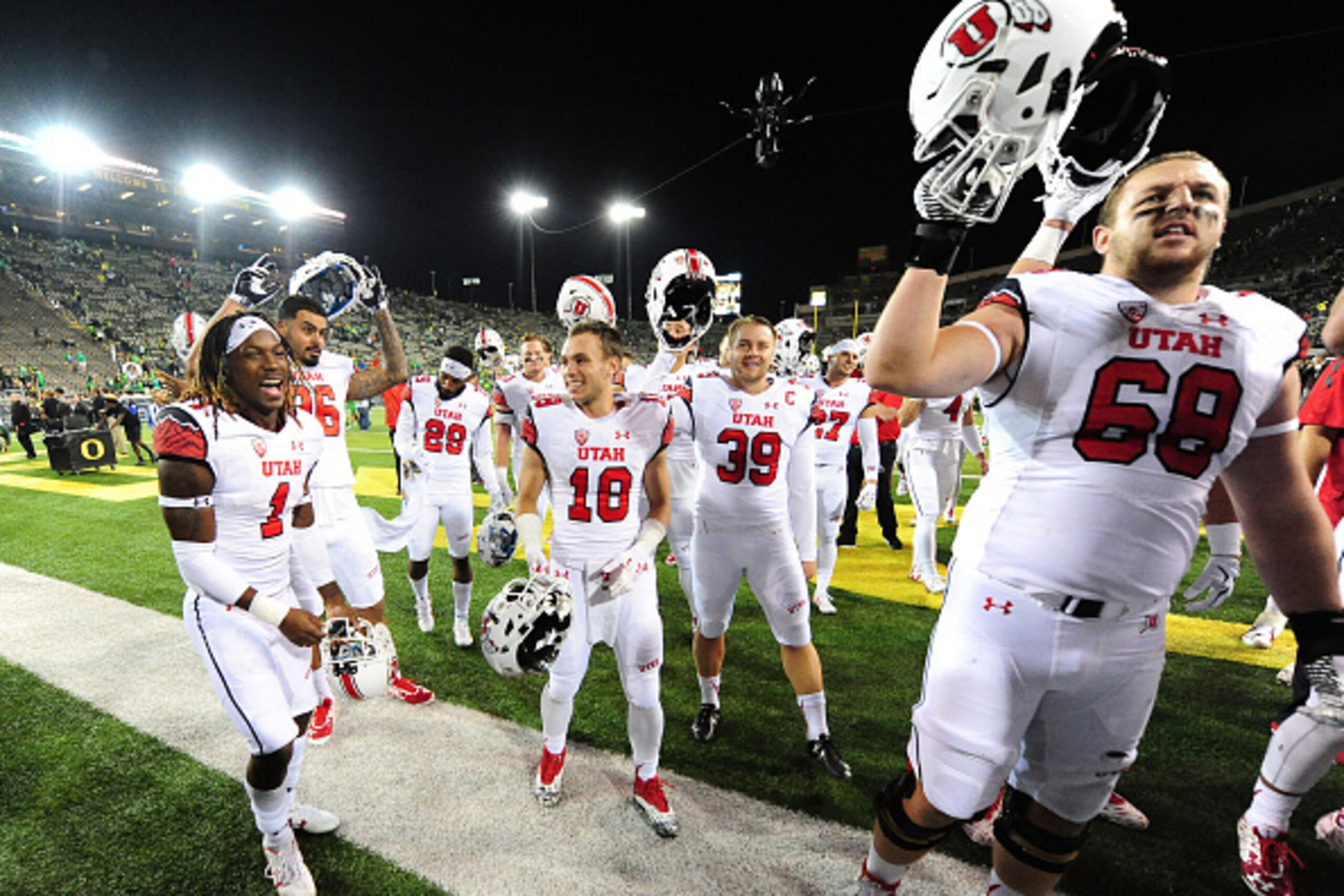 EUGENE, OR - SEPTEMBER 26:  The Utah Utes celebrate with fans after they beat the Oregon Ducks 62-20 at Autzen Stadium on September 26, 2015 in Eugene, Oregon.  (Photo by Steve Dykes/Getty Images)