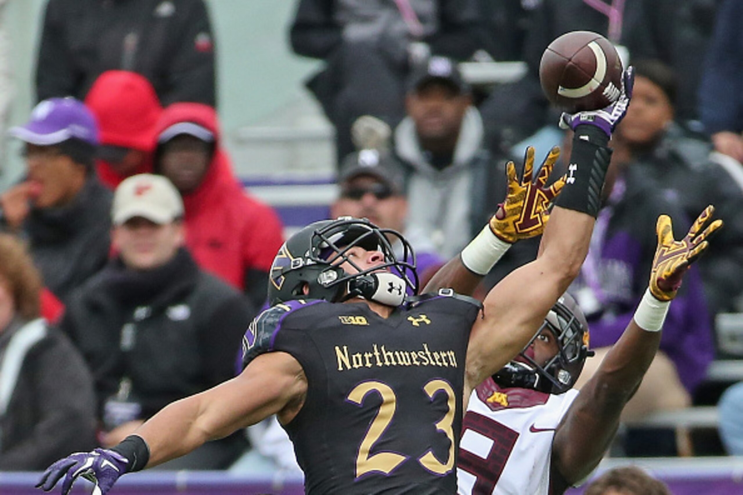 EVANSTON, IL - OCTOBER 03: Nick VanHoose #23 of the Northwestern Wildcats breaks up a pass intended for Eric Carter #9 of the Minnesota Golden Gophers
at Ryan Field on October 3, 2015 in Evanston, Illinois. Northwestern defeated Minnesota 27-0. (Photo by 