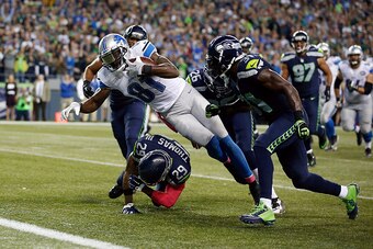 SEATTLE, WA - OCTOBER 05:  Calvin Johnson #81 of the Detroit Lions dives for the end zone during the fourth quarter of a game against the Seattle Seahawks at CenturyLink Field on October 5, 2015 in Seattle, Washington.  (Photo by Otto Greule Jr/Getty Imag